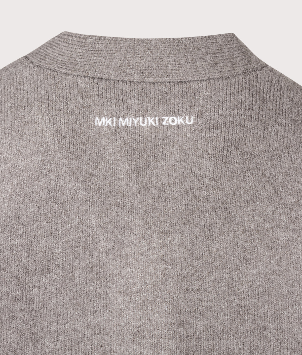 MKI MIYUKI ZOKU Relaxed Box Fit Double Knit Cardigan in Brown at EQVVS Menswear. Detail shot.