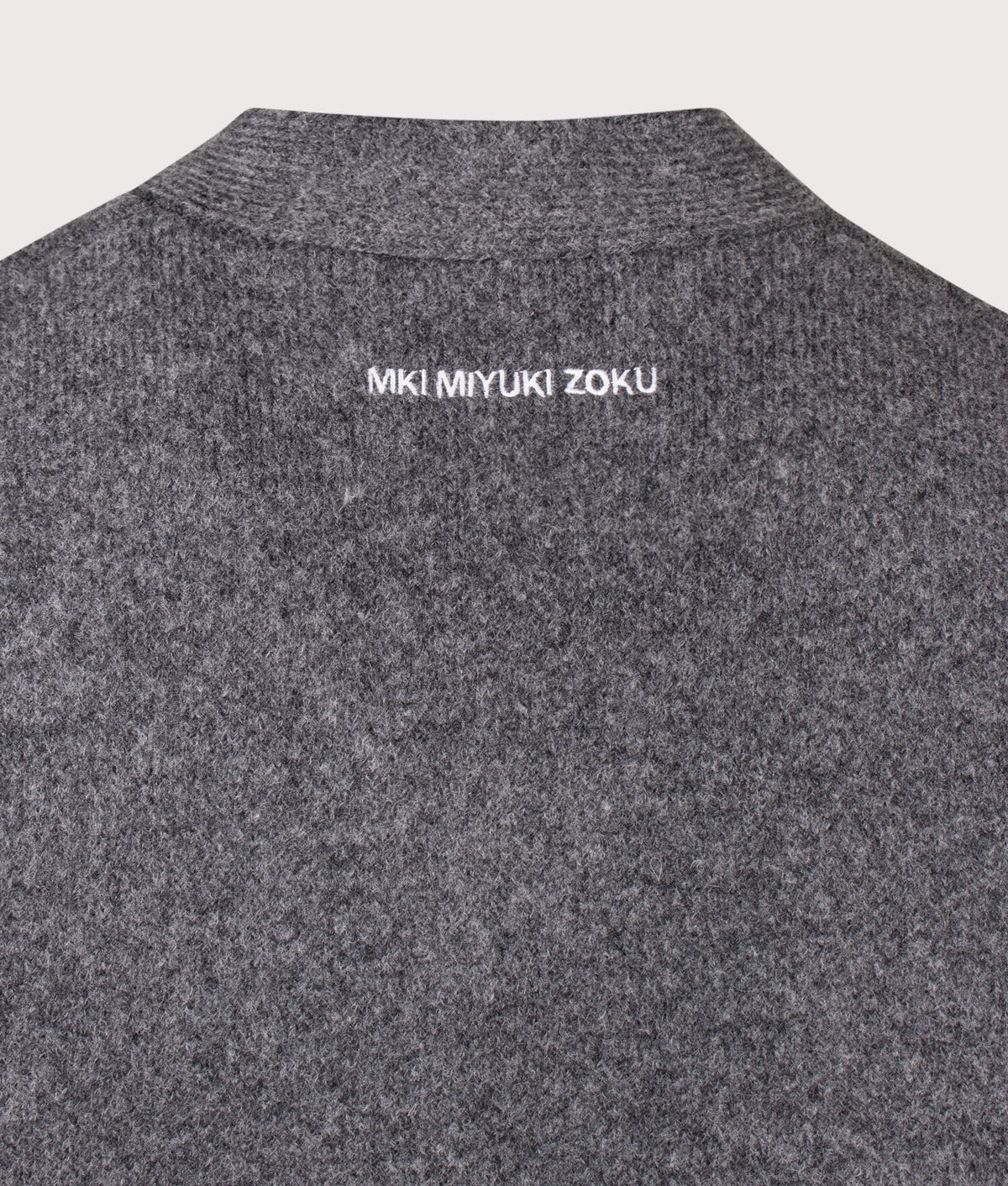 MKI MIYUKI ZOKU Relaxed Box Fit Double Knit Cardigan in Charcoal at EQVVS Menswear. Detail shot.