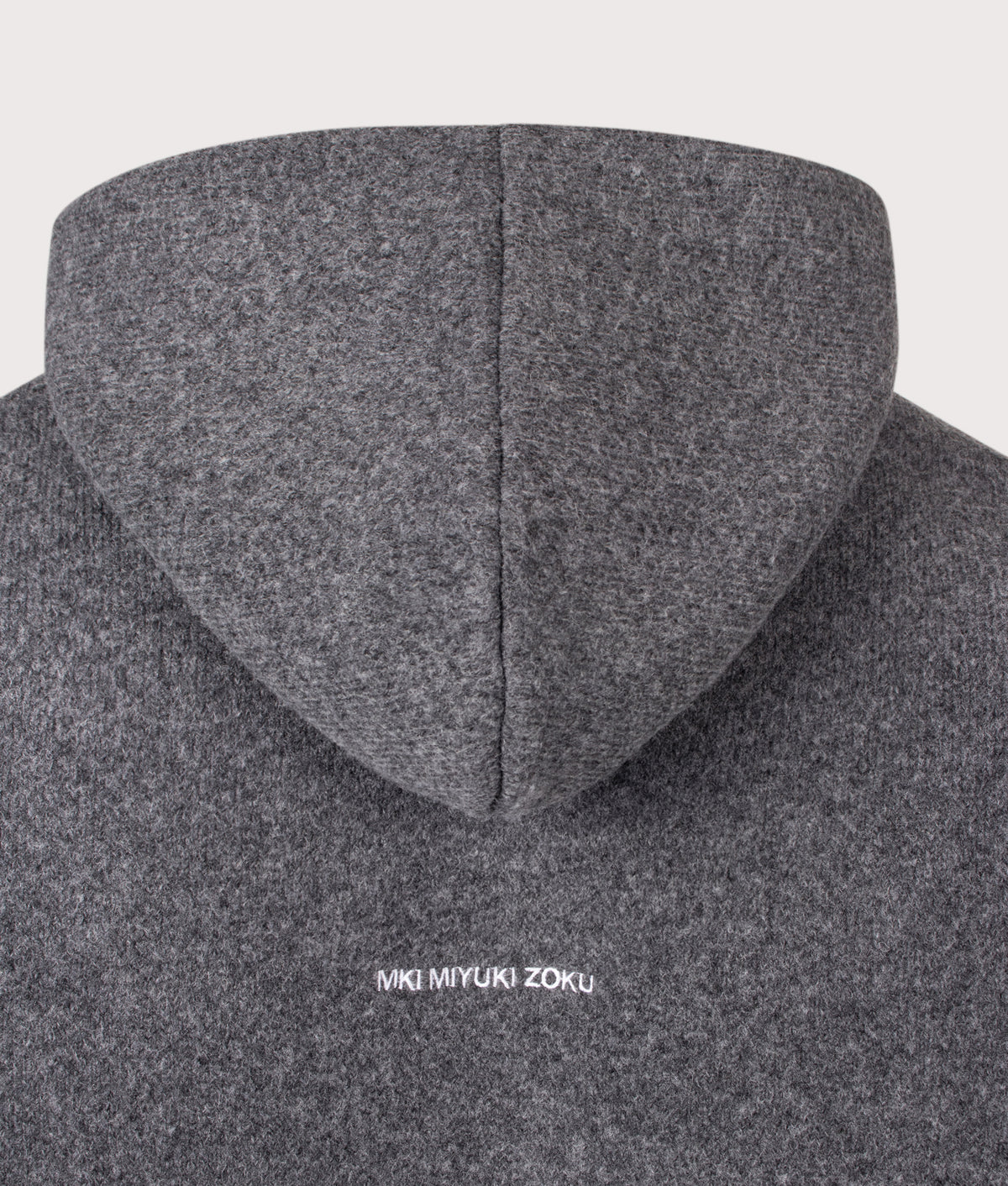MKI MIYUKI ZOKU Relaxed Box Fit Double Knit Hoodie in Charcoal at EQVVS Menswear. Back detail shot.