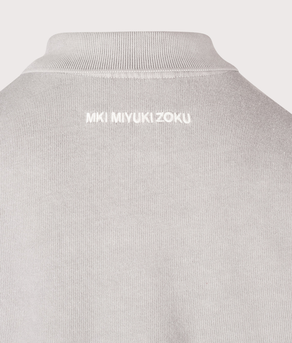 MKI MIYUKI ZOKU Relaxed Box Fit 400 GSM Pigment Dyed Rugby Shirt in Pigment Stone at EQVVS Menswear. Detail shot.