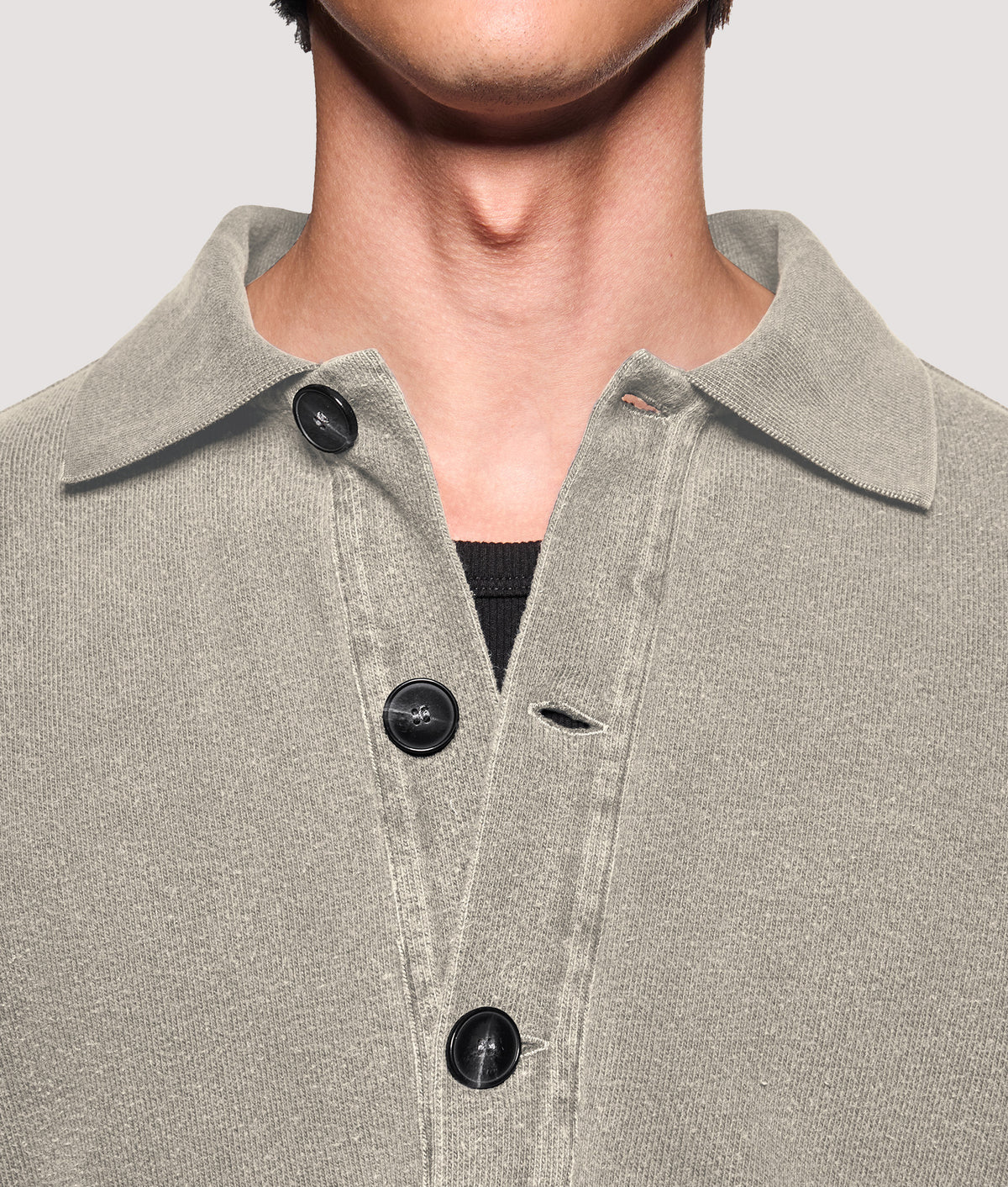 MKI MIYUKI ZOKU Relaxed Box Fit 400 GSM Pigment Dyed Rugby Shirt in Pigment Stone at EQVVS Menswear. Placket detail shot.