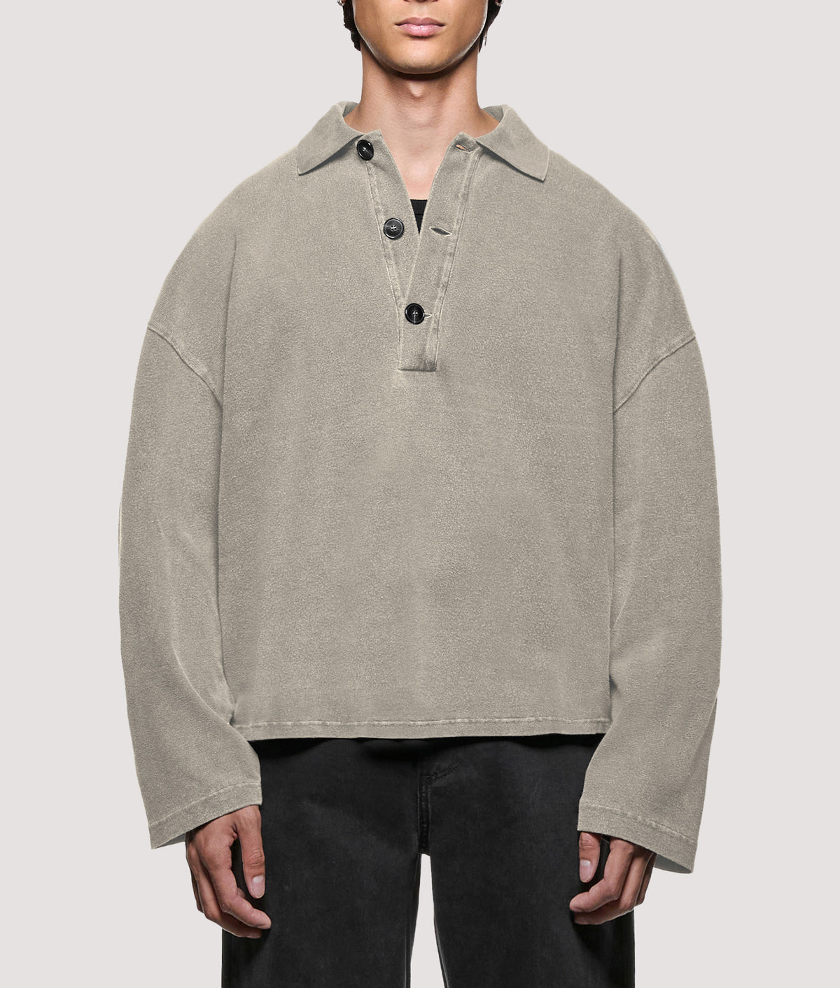MKI MIYUKI ZOKU Relaxed Box Fit 400 GSM Pigment Dyed Rugby Shirt in Pigment Stone at EQVVS Menswear. Model front shot.