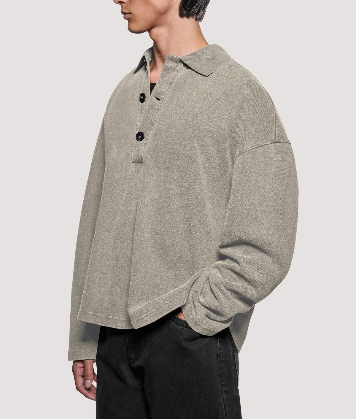 MKI MIYUKI ZOKU Relaxed Box Fit 400 GSM Pigment Dyed Rugby Shirt in Pigment Stone at EQVVS Menswear. Angled model front shot.