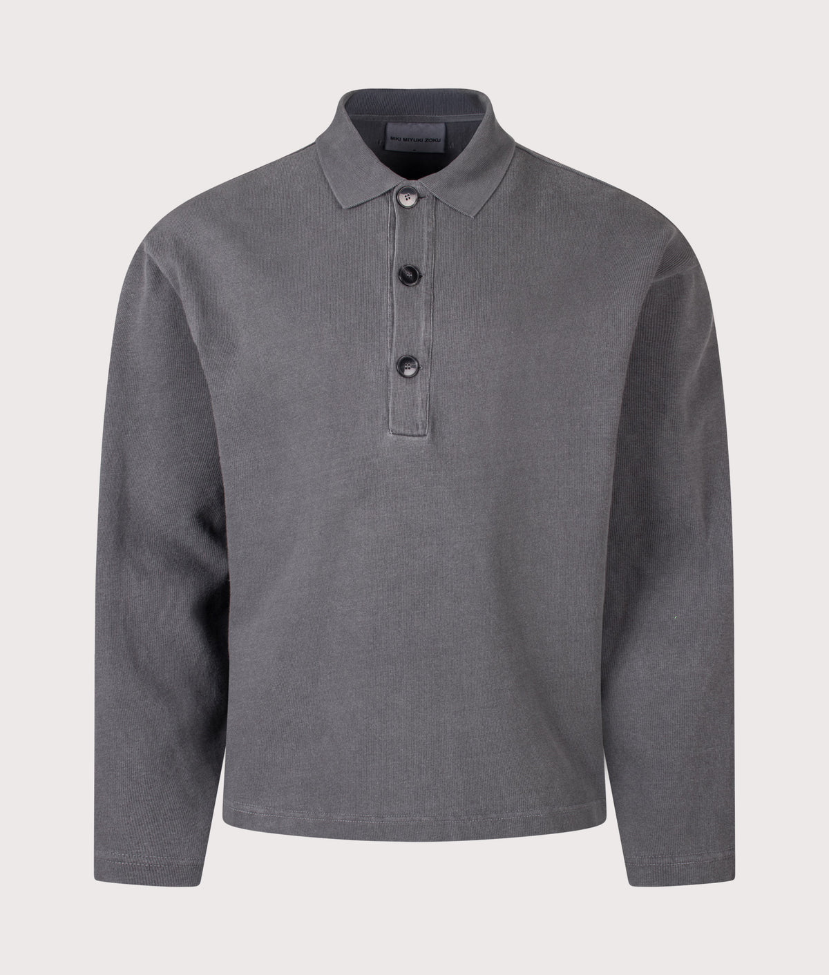 MKI MIYUKI ZOKU Relaxed Box Fit 400 GSM Pigment Dyed Rugby Shirt in Pigment Black at EQVVS Menswear. Front shot.
