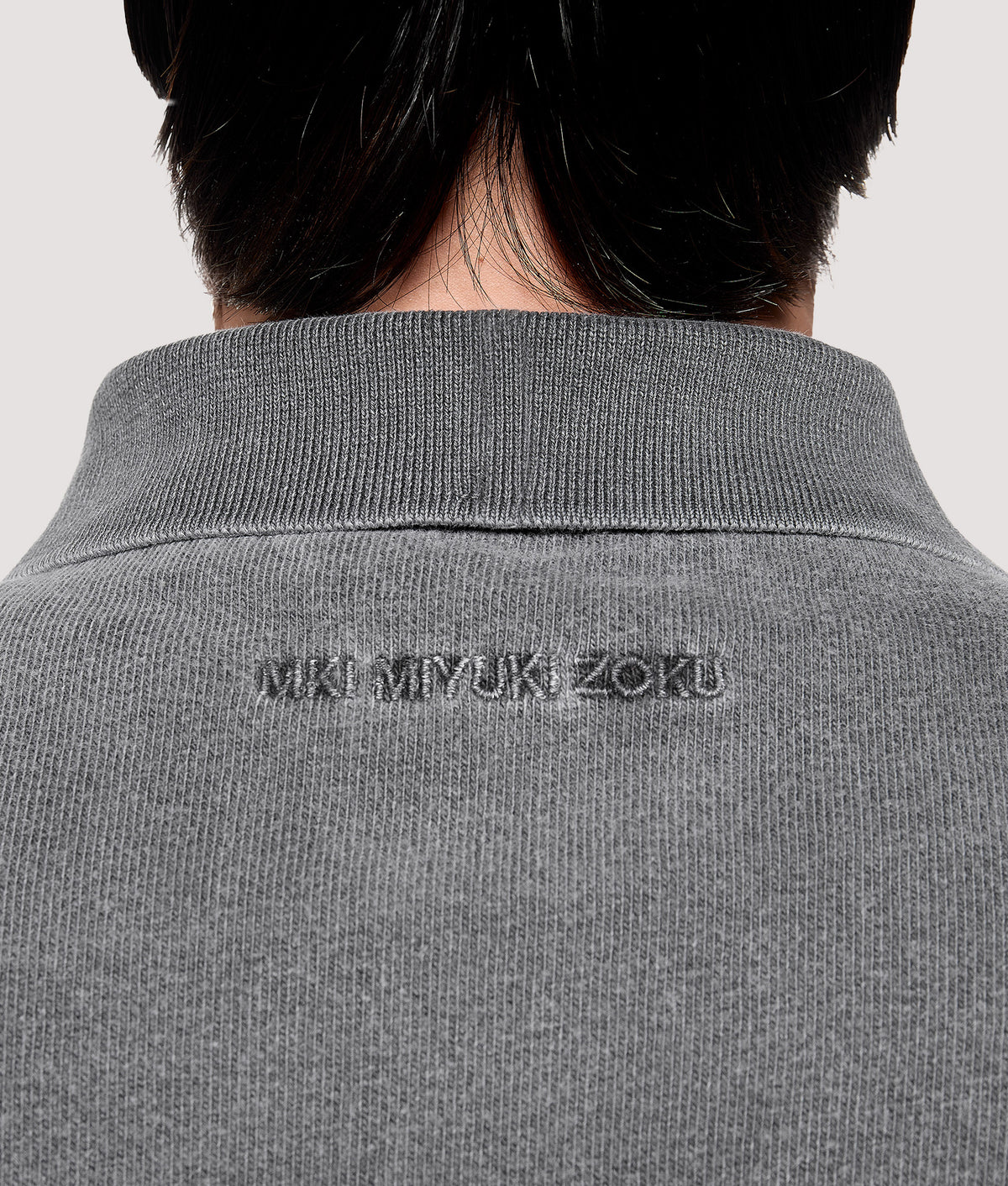 MKI MIYUKI ZOKU Relaxed Box Fit 400 GSM Pigment Dyed Rugby Shirt in Pigment Black at EQVVS Menswear. Back dettail shot.