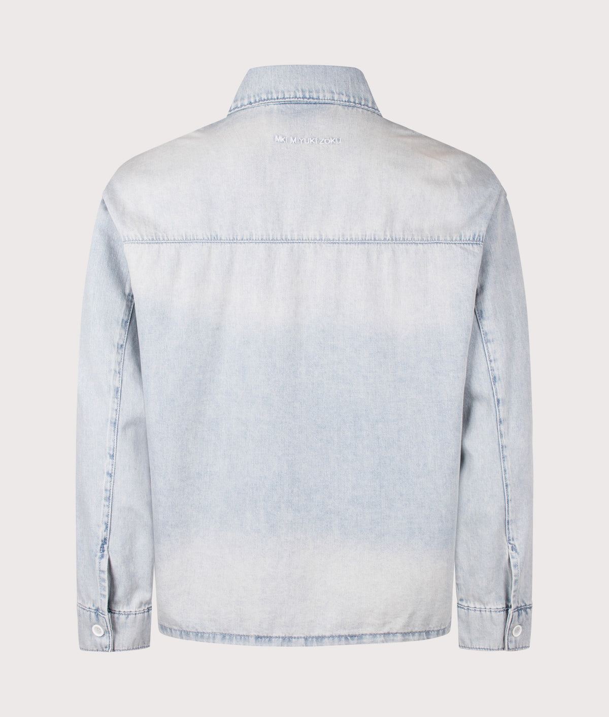 MKI MIYUKI ZOKU Relaxed Box Fit Dress Shirt in Sunfaded Denim at EQVVS Menswear. Back shot.