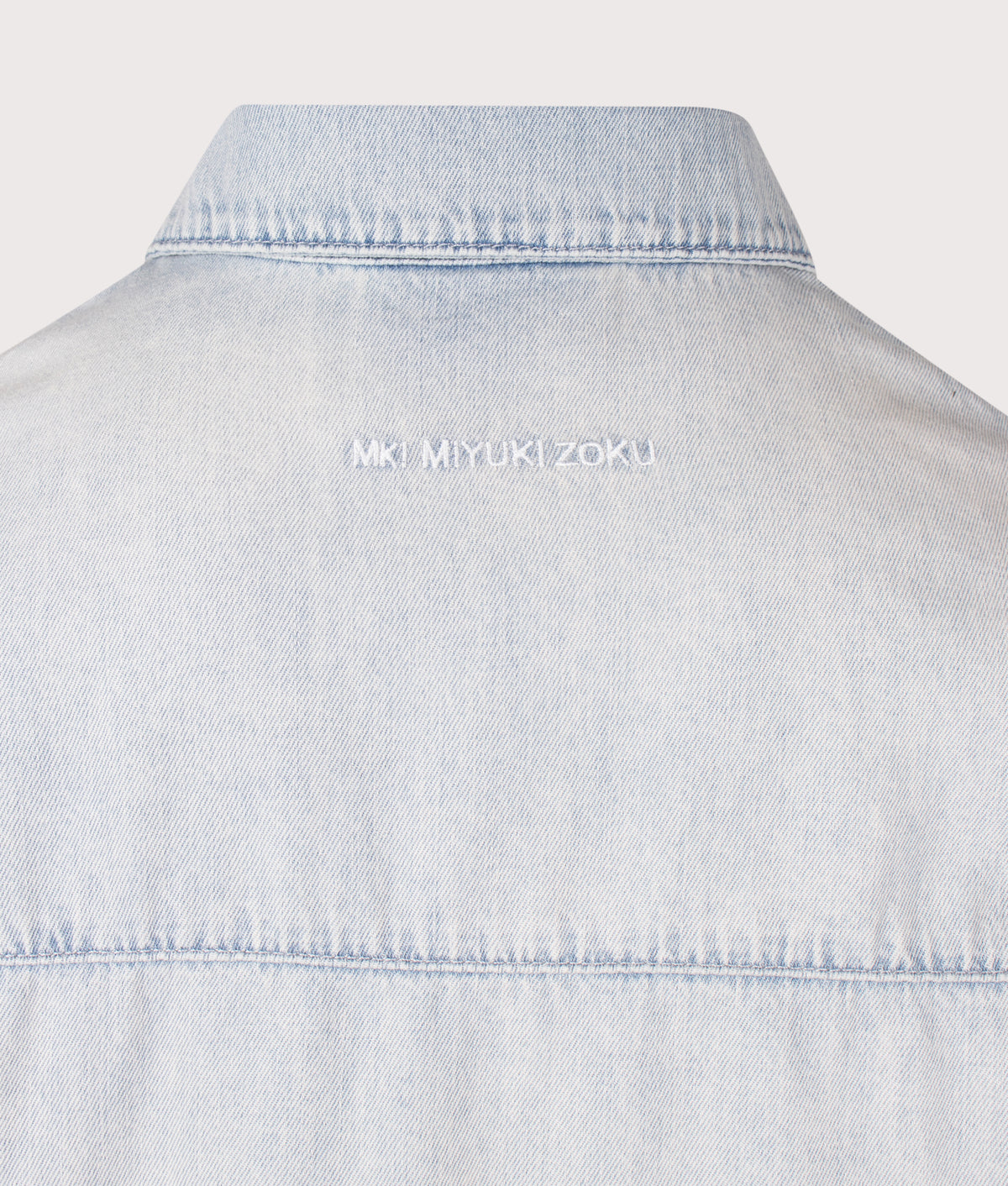 MKI MIYUKI ZOKU Relaxed Box Fit Dress Shirt in Sunfaded Denim at EQVVS Menswear. Detail shot.