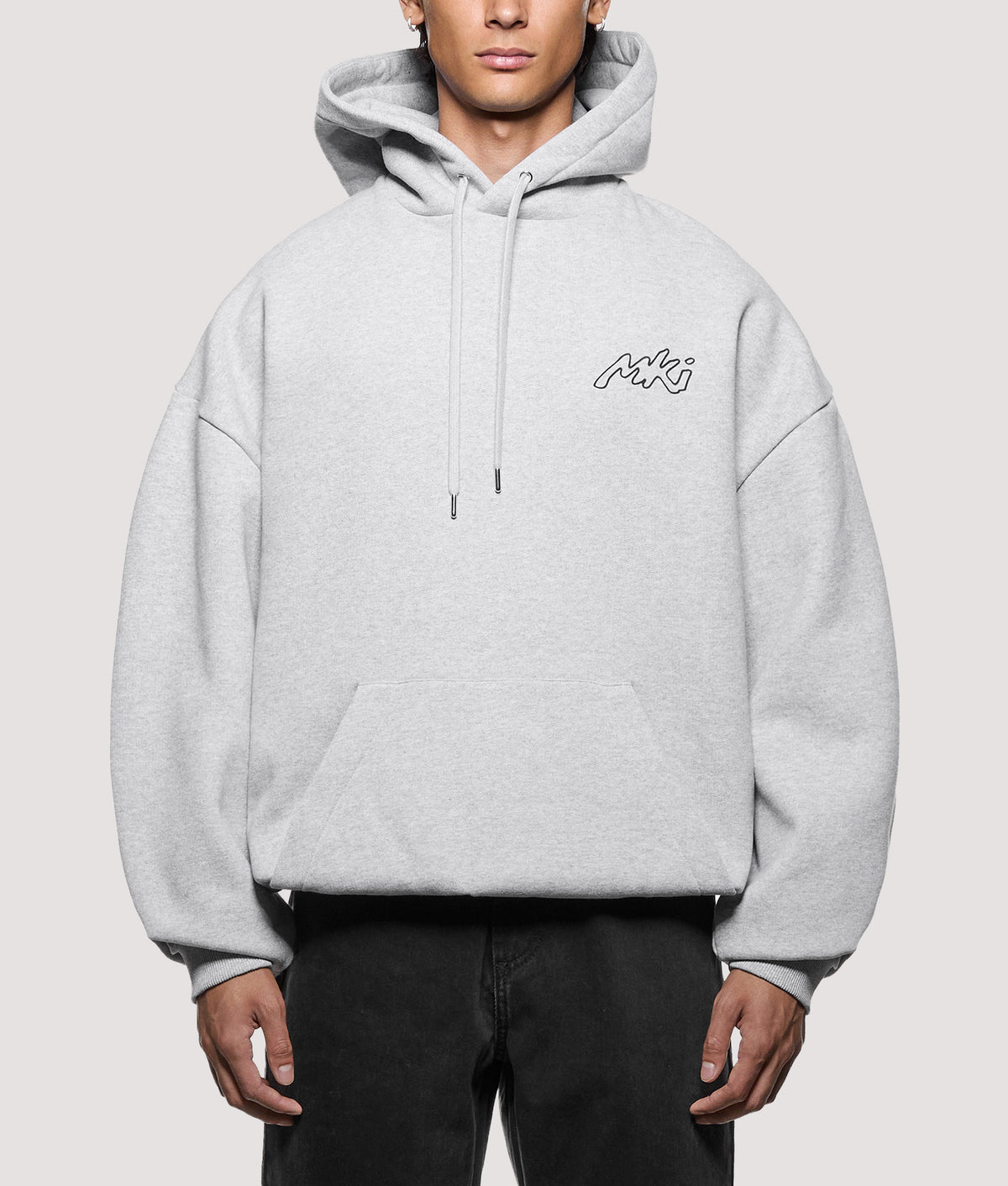 MKI MIYUKI ZOKU Oversized Box Fit Ink Line Hoodie in Grey at EQVVS Menswear. Model front shot.