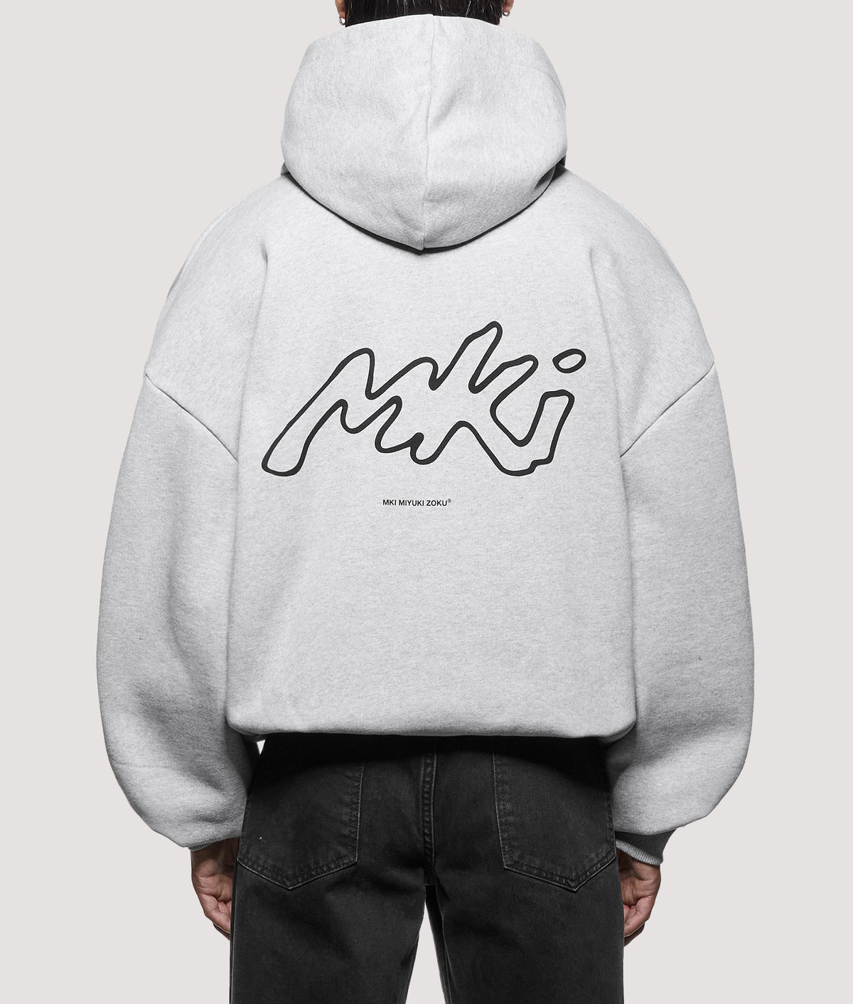 MKI MIYUKI ZOKU Oversized Box Fit Ink Line Hoodie in Grey at EQVVS Menswear. Model back shot.