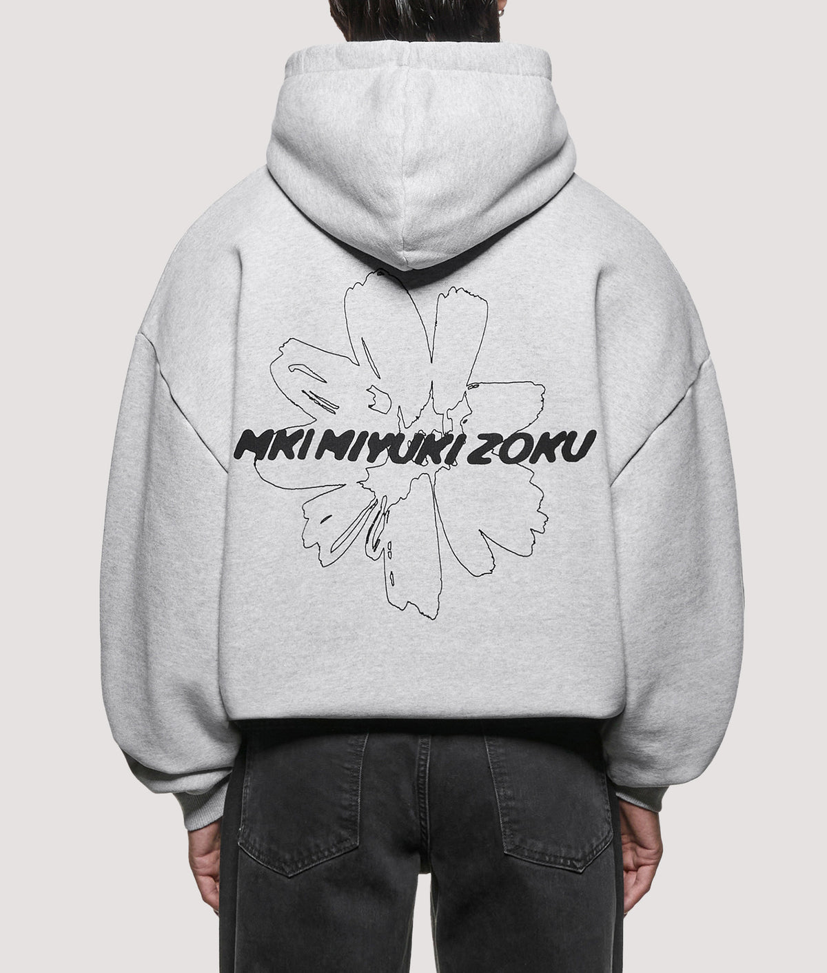 MKI MIYUKI ZOKU Oversized Box Fit Wildflower Hoodie in Grey at EQVVS Menswear. Front shot.