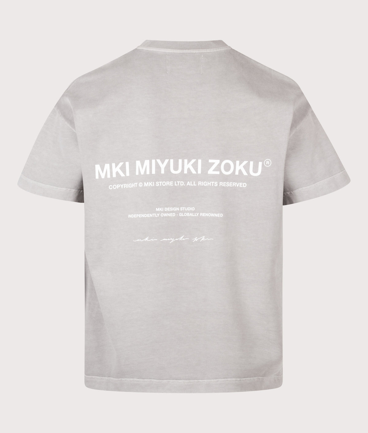 MKI MIYUKI ZOKU Oversized Box Fit Design Studio T-Shirt in Pigment Stone at EQVVS Menswear. Back shot.