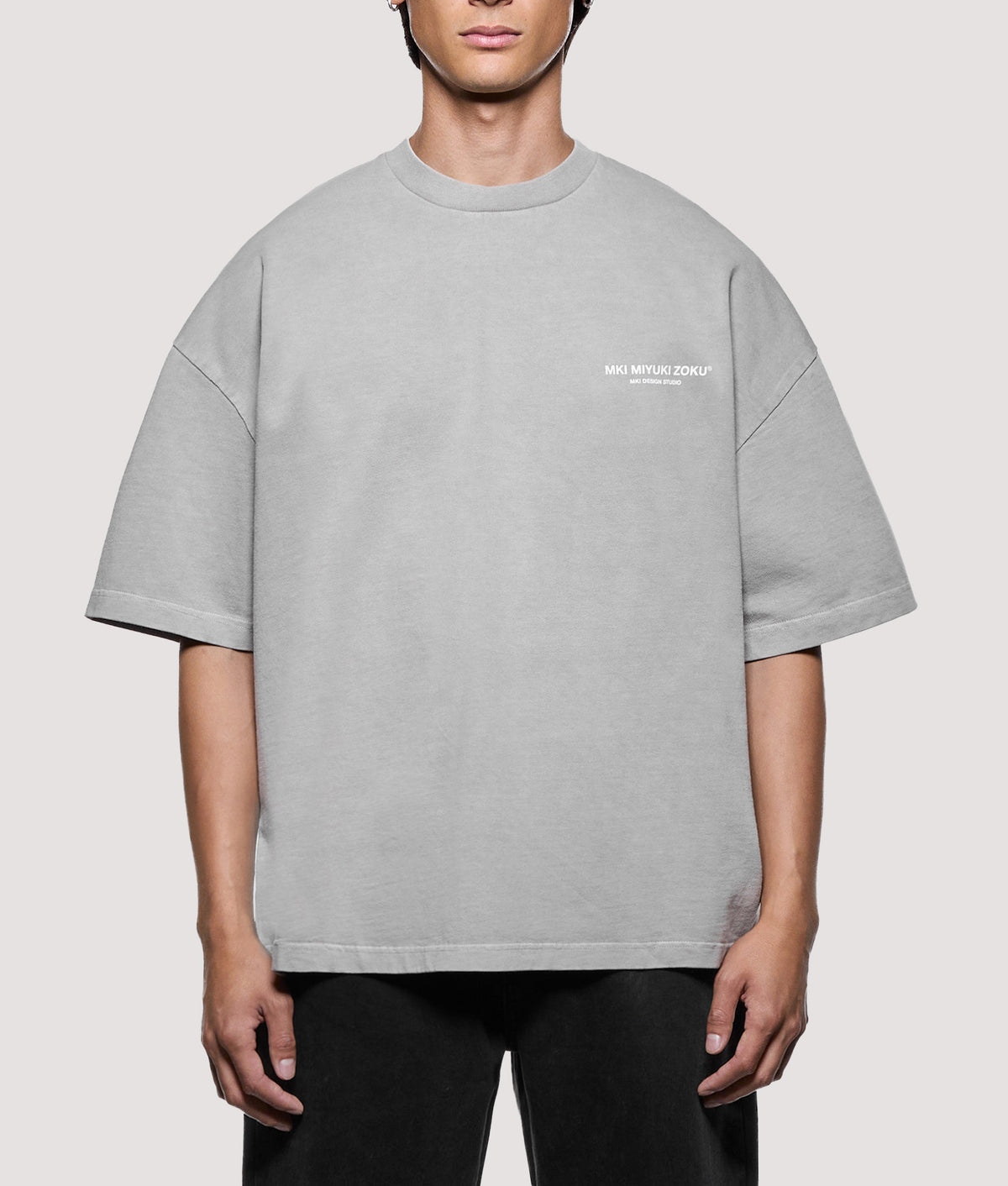 MKI MIYUKI ZOKU Oversized Box Fit Design Studio T-Shirt in Pigment Stone at EQVVS Menswear. Model front shot.