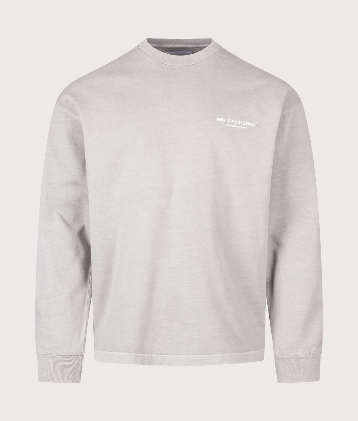 MKI MIYUKI ZOKU Oversized Box Fit Design Studio Long Sleeve T-Shirt in Pigment Stone at EQVVS Menswear. Front shot.