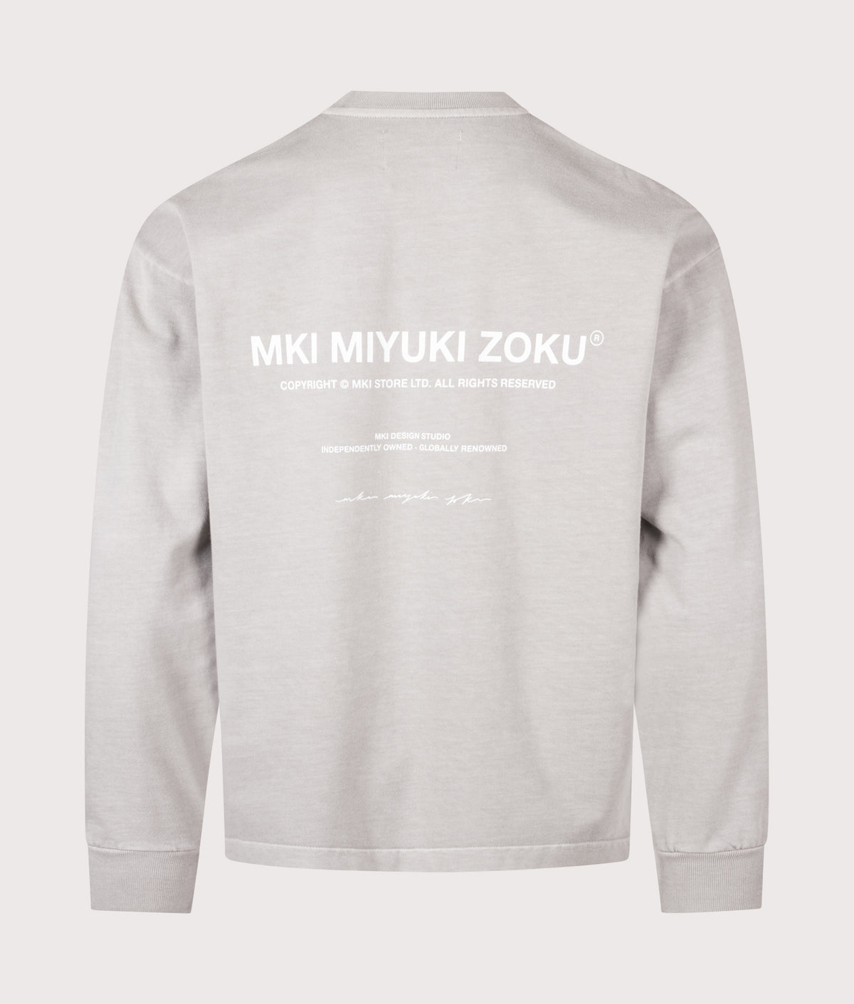 MKI MIYUKI ZOKU Oversized Box Fit Design Studio Long Sleeve T-Shirt in Pigment Stone at EQVVS Menswear. Back shot.