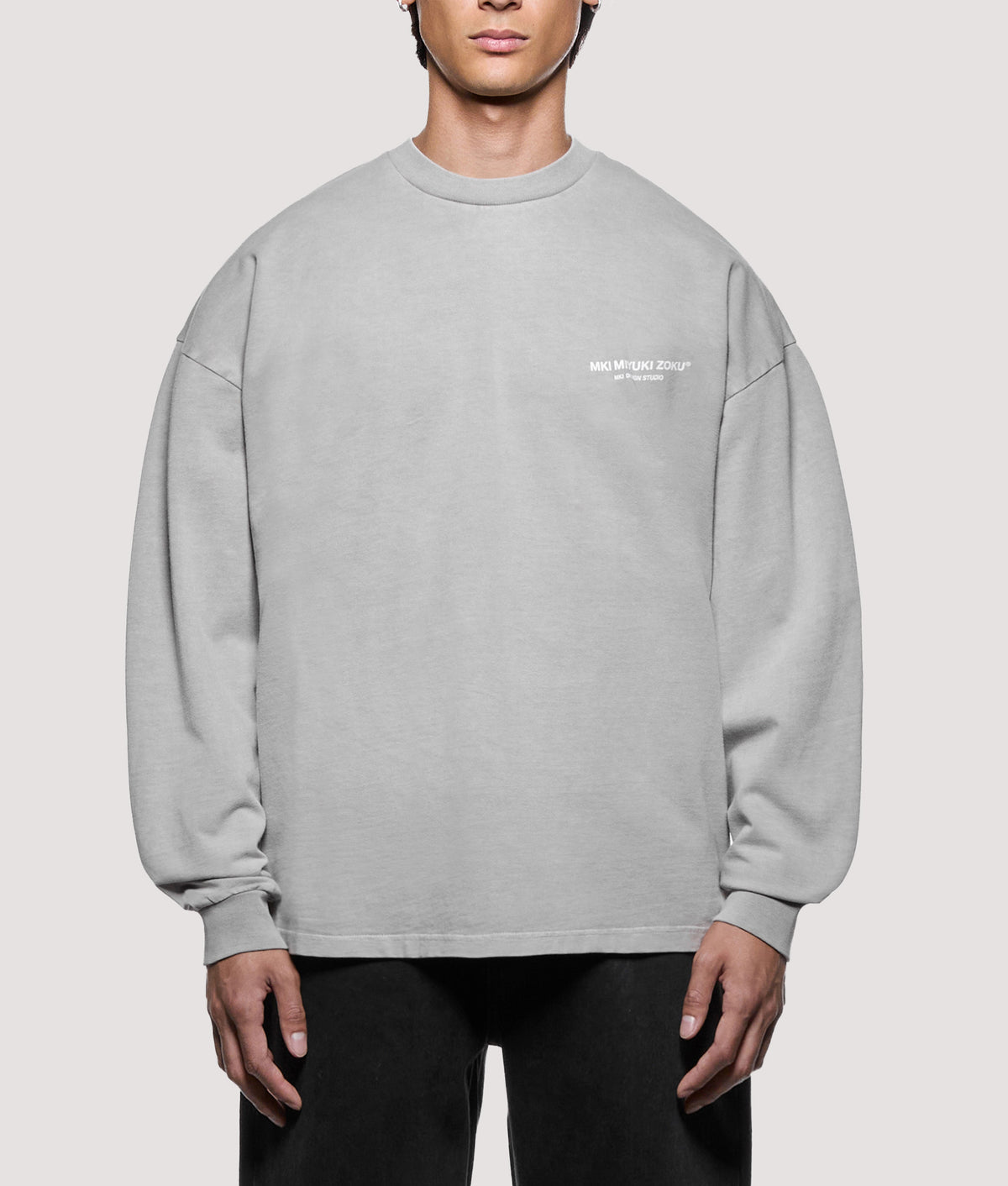 MKI MIYUKI ZOKU Oversized Box Fit Design Studio Long Sleeve T-Shirt in Pigment Stone at EQVVS Menswear. Model front shot.