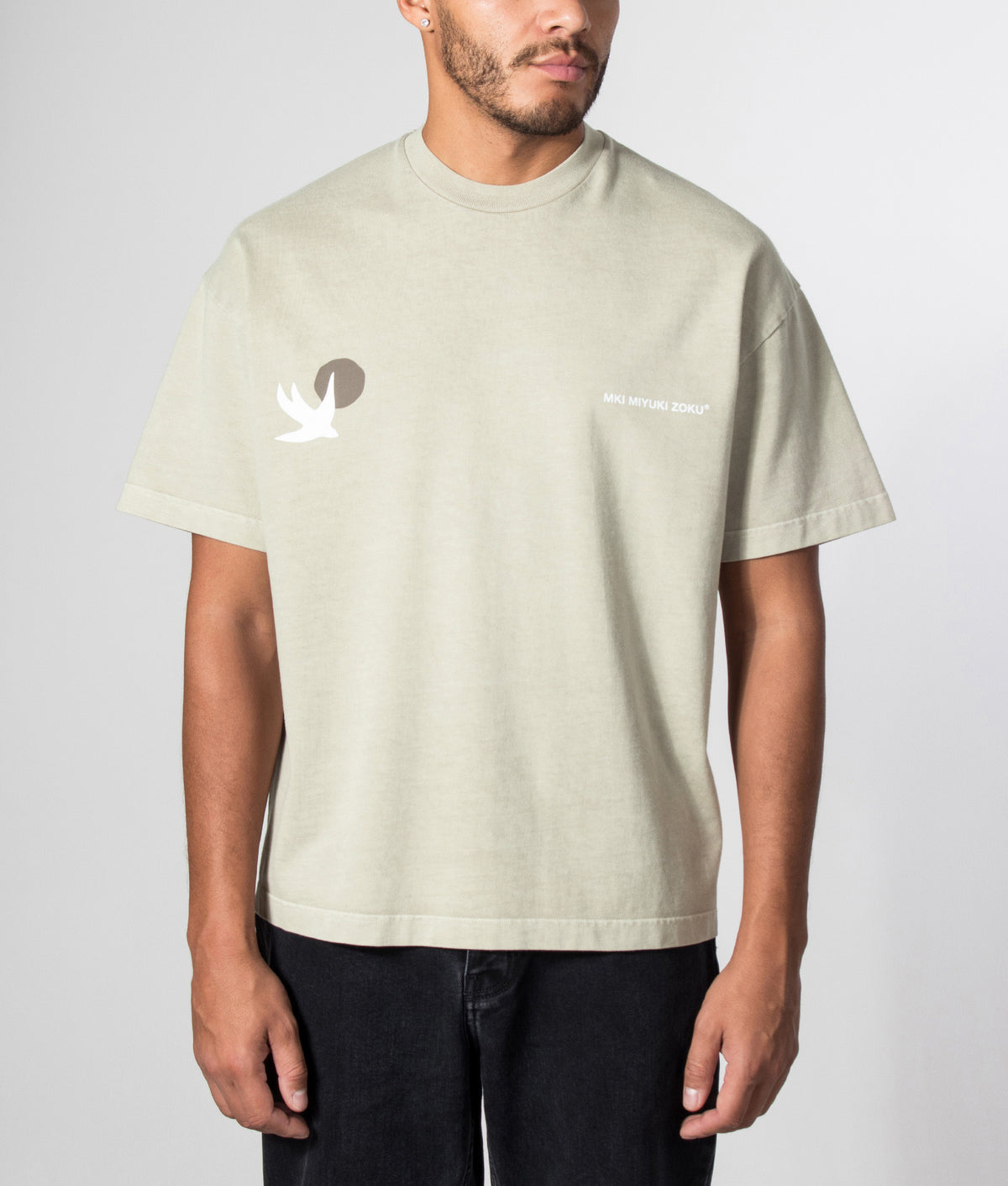 MKI MIYUKI ZOKU Oversized Swallow T-Shirt in Pigment Cement at EQVVS Menswear. Model front shot.