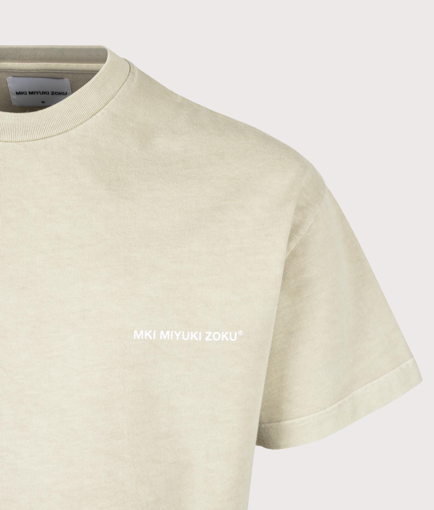 MKI MIYUKI ZOKU Oversized Swallow T-Shirt in Pigment Cement at EQVVS Menswear. Detail MKI shot.
