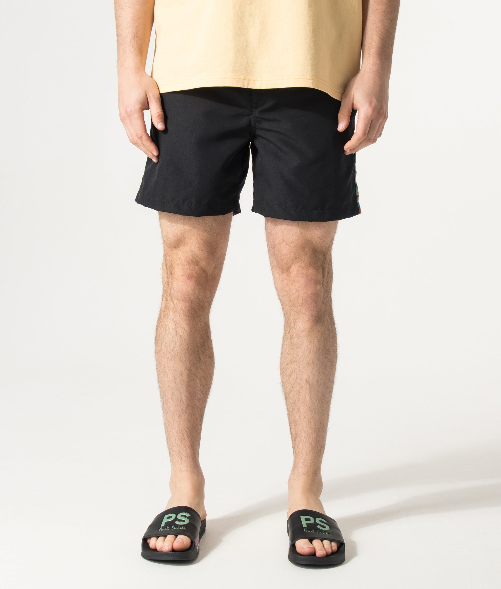 PS Paul Smith Signature Stripe Swim Shorts in Black at EQVVS Menswear. Model front shot.