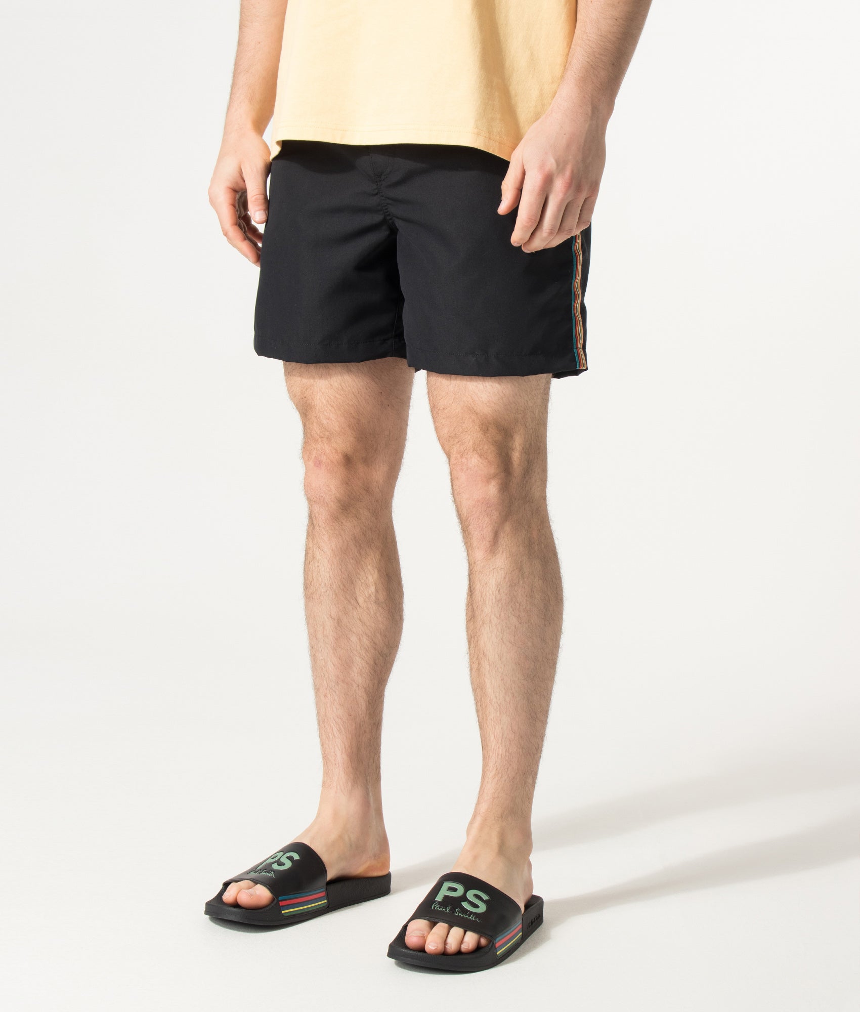 PS Paul Smith Signature Stripe Swim Shorts in Black at EQVVS Menswear. Angled model front shot.