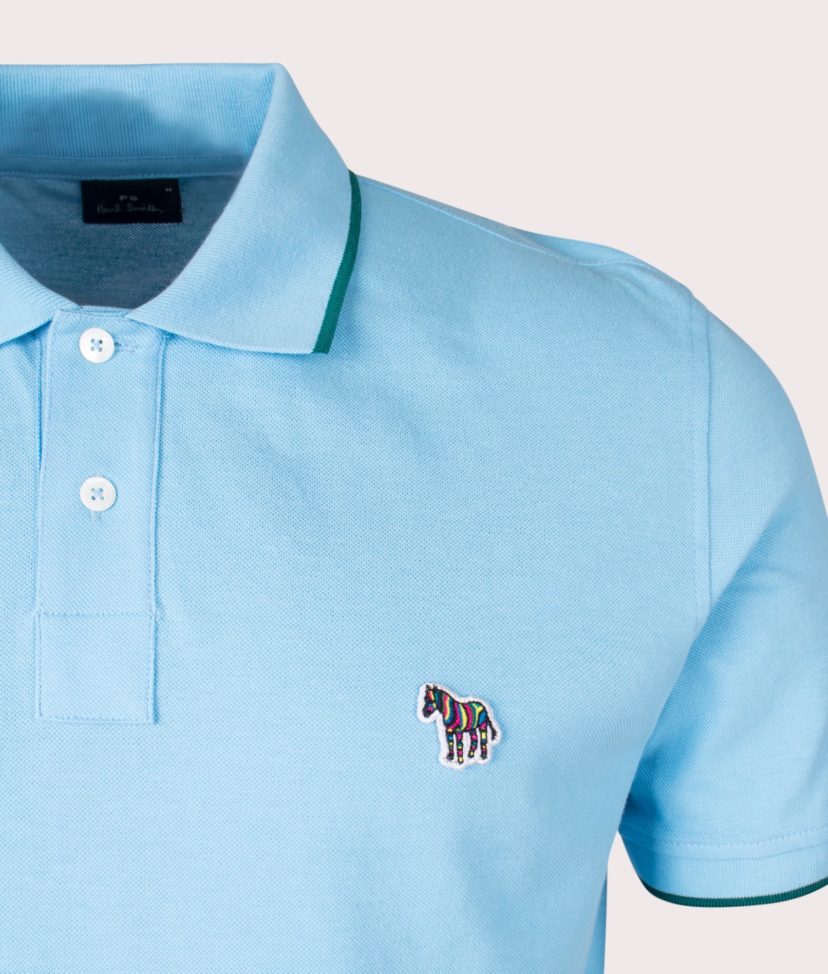 Zebra Badge Polo Shirt in Light Blue by PS Paul Smith. EQVVS Detail Shot.