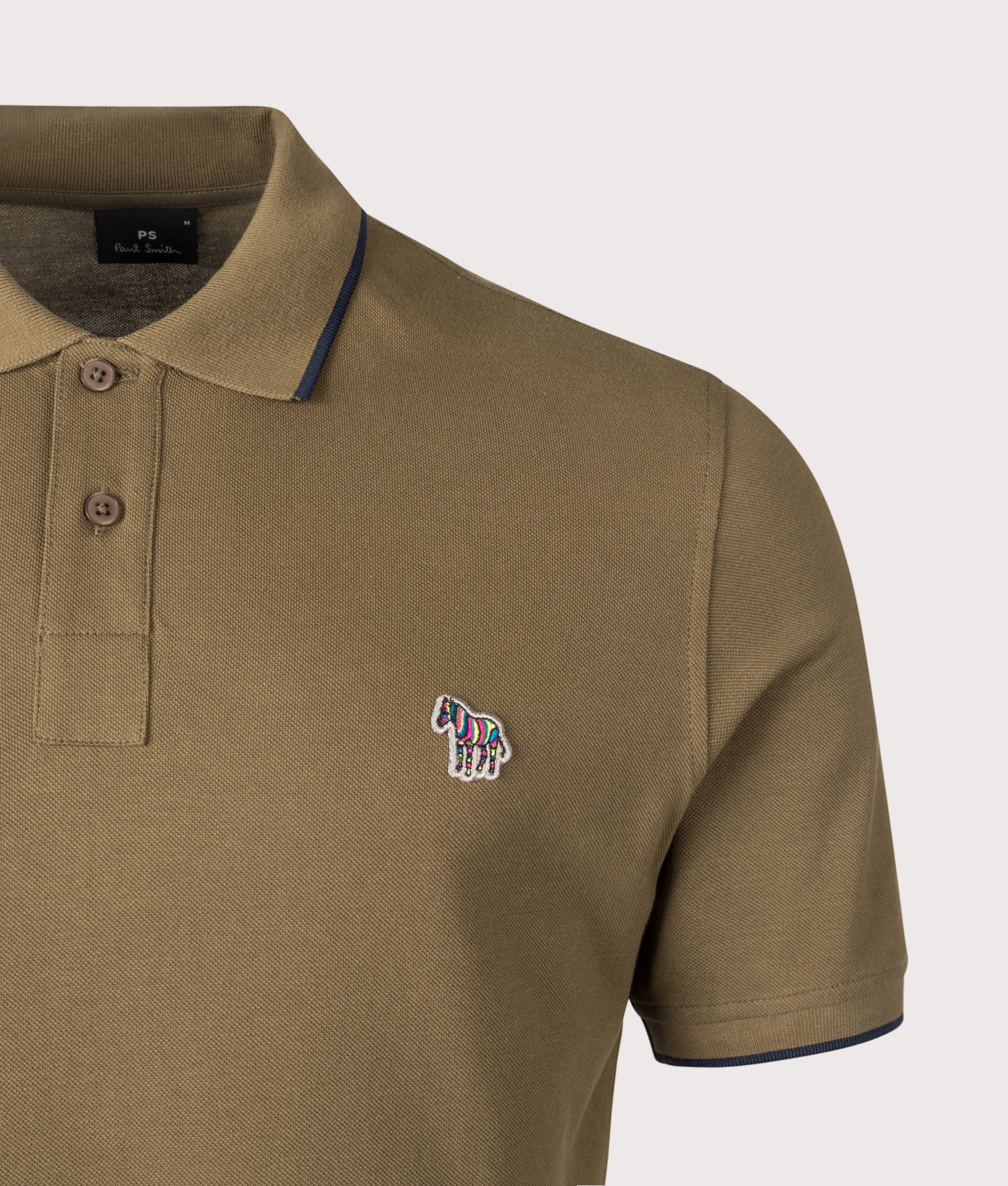 Zebra Badge Polo Shirt. Shot by EQVVS. Detail shot.