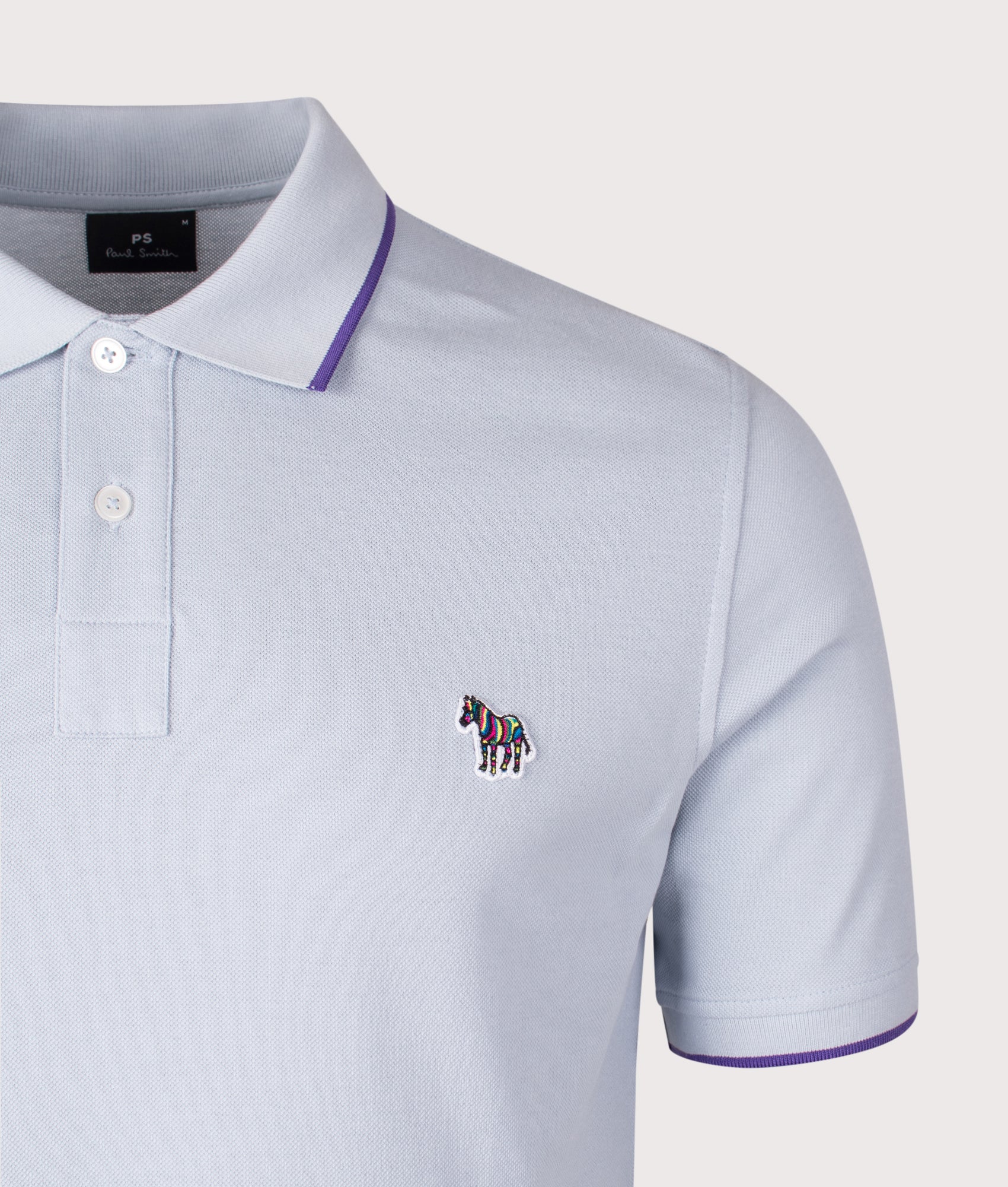 Zebra Badge Polo Shirt. Shot by EQVVS. Detail shot.