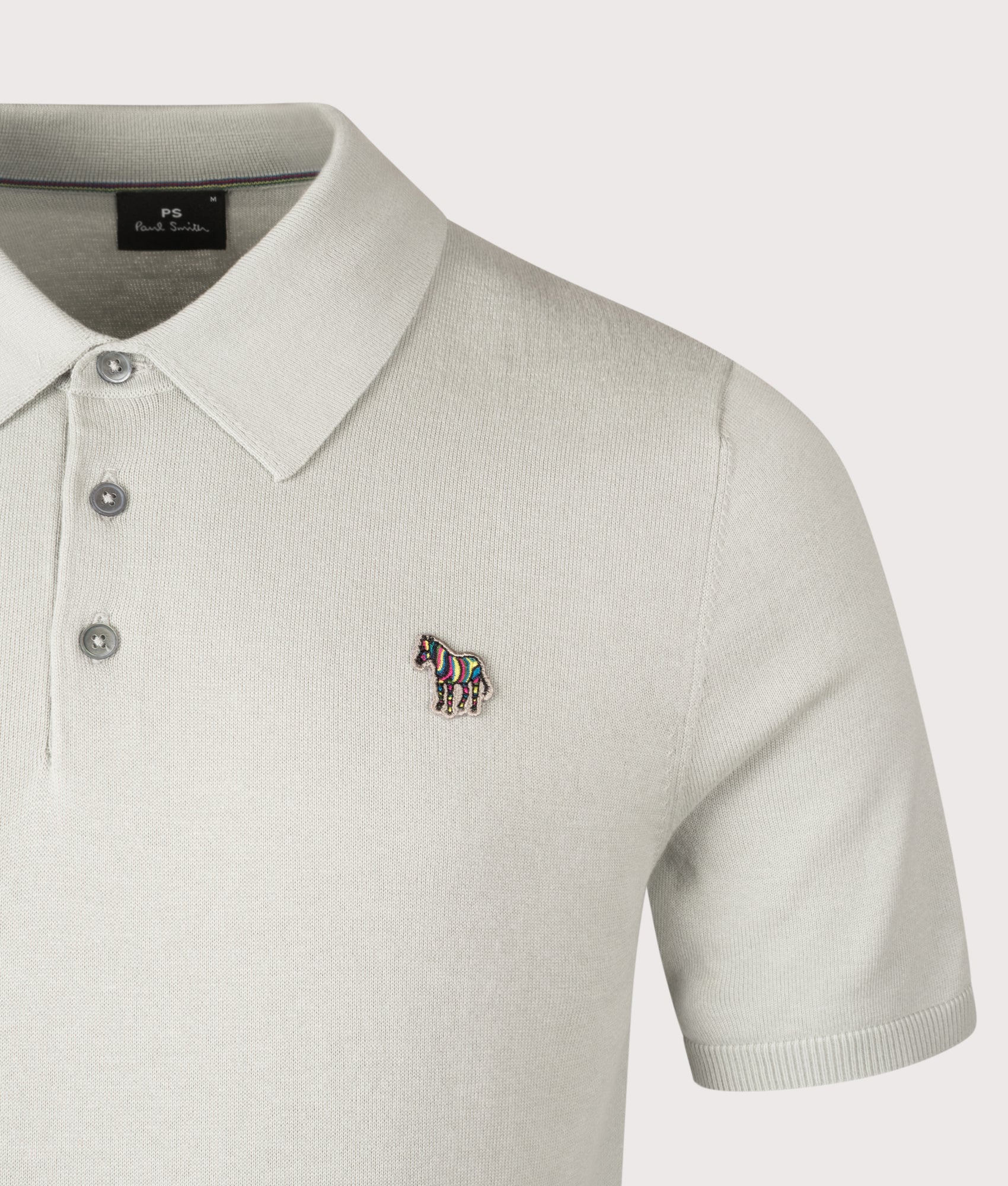 Zebra Badge Polo Shirt. Shot by EQVVS. Detail shot.