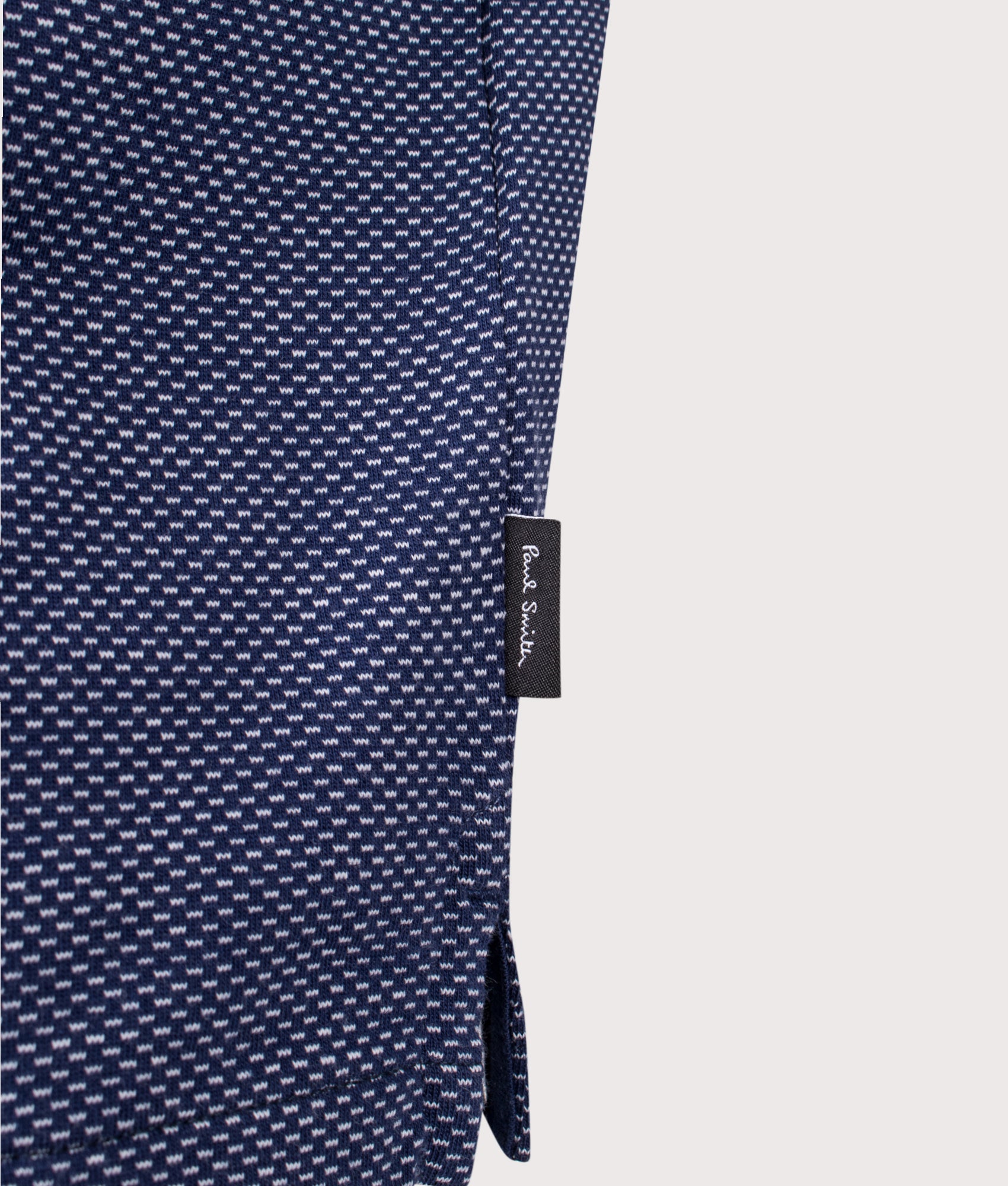 Button Front Zebra Emblem Polo Shirt in Inky Blue | Paul Smith | EQVVS | Hip detail shot 