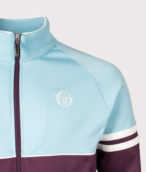 Sergio Tacchini Orion Track Jacket in Milky Blue, Winter Bloom and Gardenia at EQVVS Menswear. Detail shot.