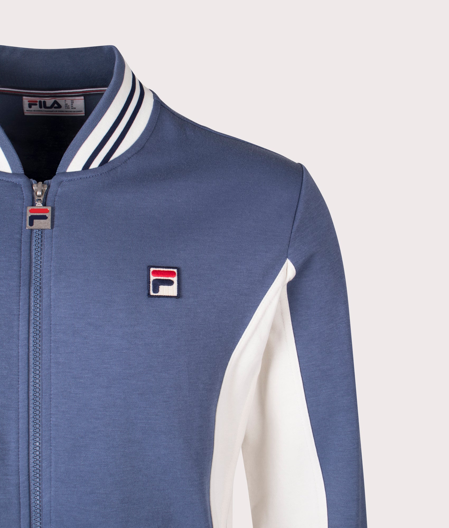 FILA Settanta Baseball Track Jacket in Vintage Indigo/Gardenia/Fila Navy at EQVVS Menswear. Detail shot.