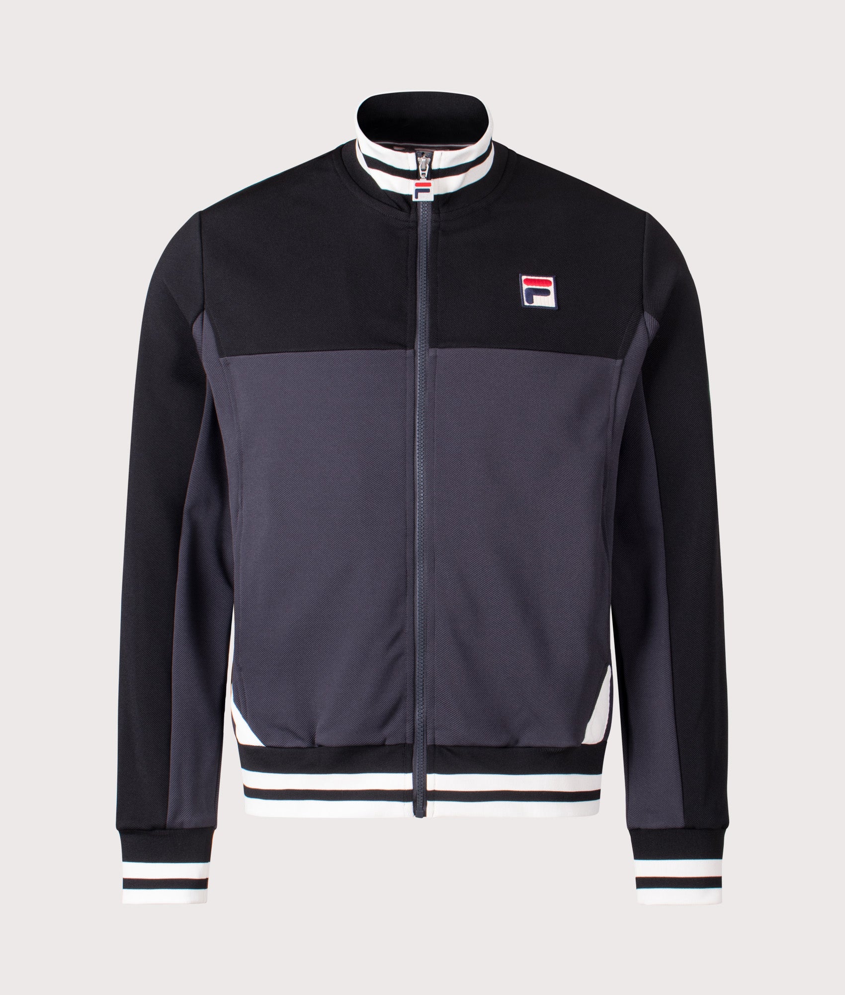 Tiebraker Funnel Neck Track Jacket by FILA in Black/Charcoal/Gardenia. Shot by EQVVS. Front shot.