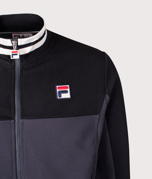 Tiebraker Funnel Neck Track Jacket by FILA in Black/Charcoal/Gardenia. Shot by EQVVS. Detail shot.