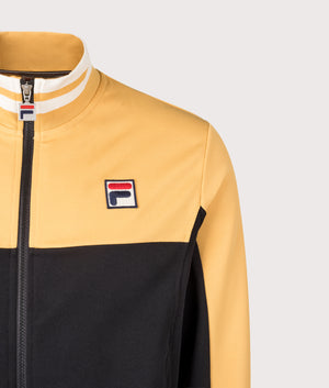 Tiebraker Funnel Neck Track Jacket by Fila in Oak Buff/Black/Gardenia. Shot by EQVVS. Detail shot.