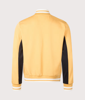 Tiebraker Funnel Neck Track Jacket by Fila in Oak Buff/Black/Gardenia. Shot by EQVVS. Back shot.