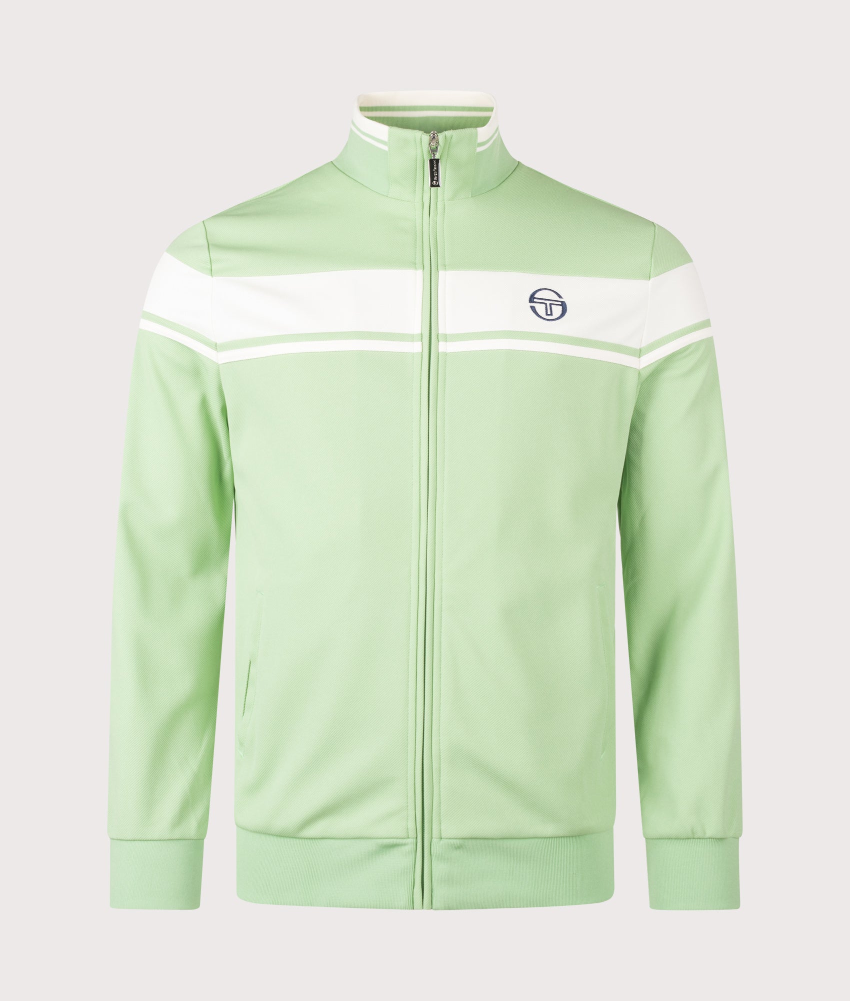 Sergio Tacchini Damarindo Track Top in Quiet Green and Gardenia at EQVVS Menswear. Front shot.