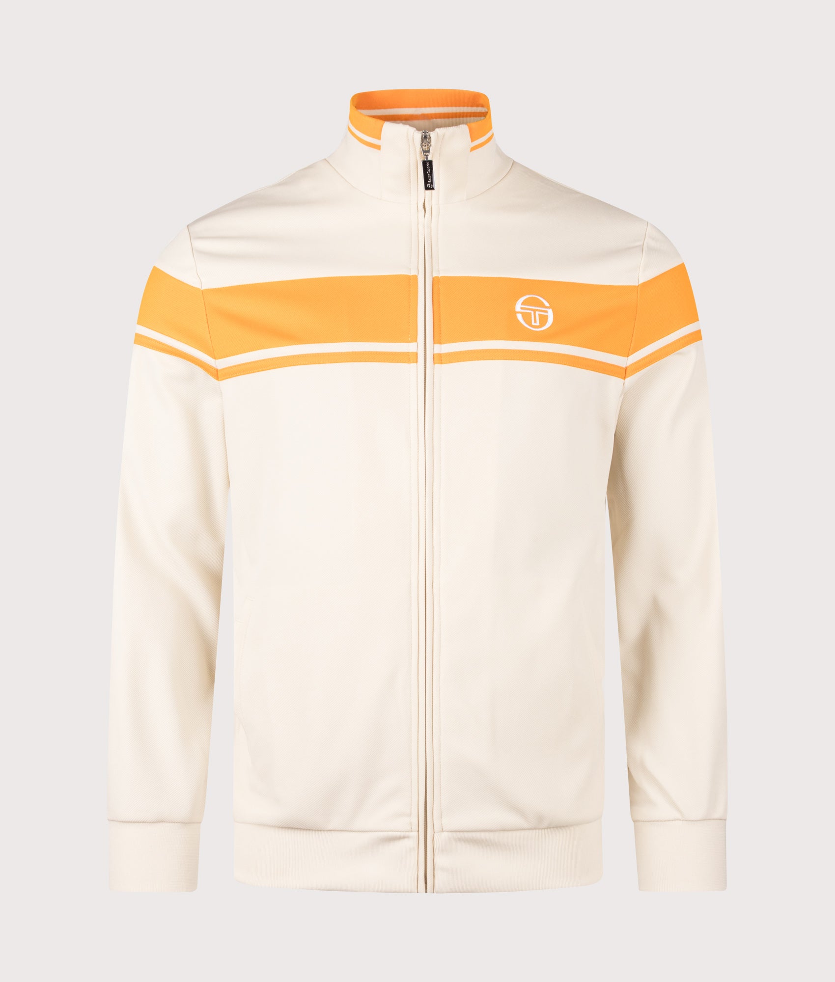 Sergio Tacchini Damarindo Track Top in Sandshell and Orange Pepper at EQVVS Menswear. Front shot.