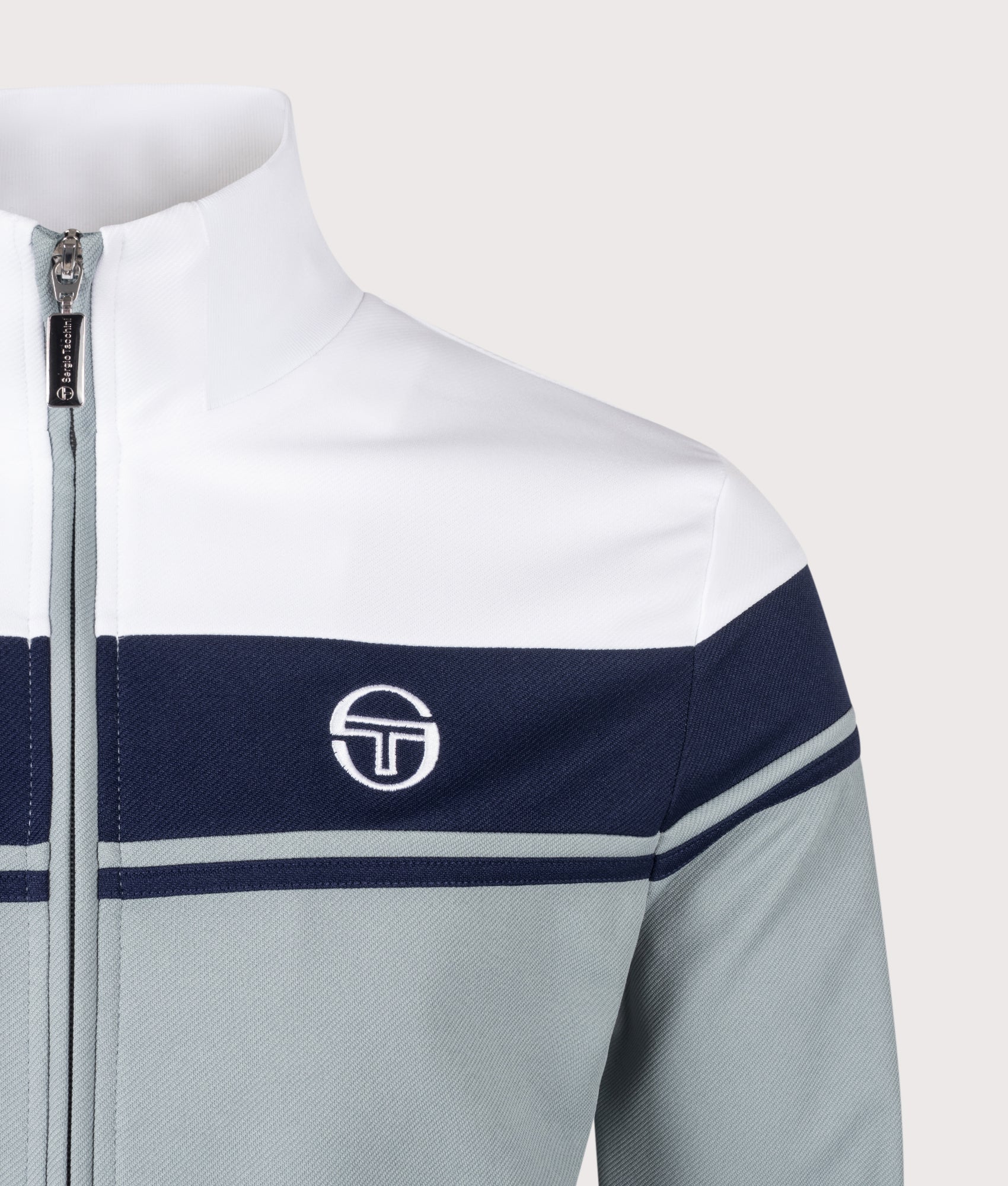 Damarindo Track Top in White/Maritime Blue/Lead by Sergio Tachinni. Shot by EQVVS. Detail Shot,