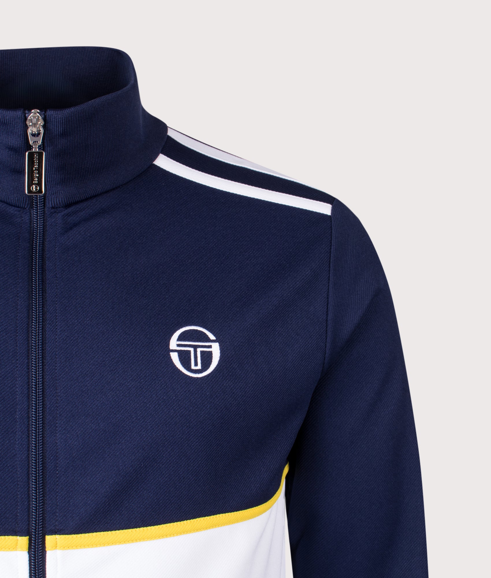 Sergio Tacchini Locchi Track Top in Maritime Blue, White and Mango Mint at EQVVS Menswear. Detail shot.