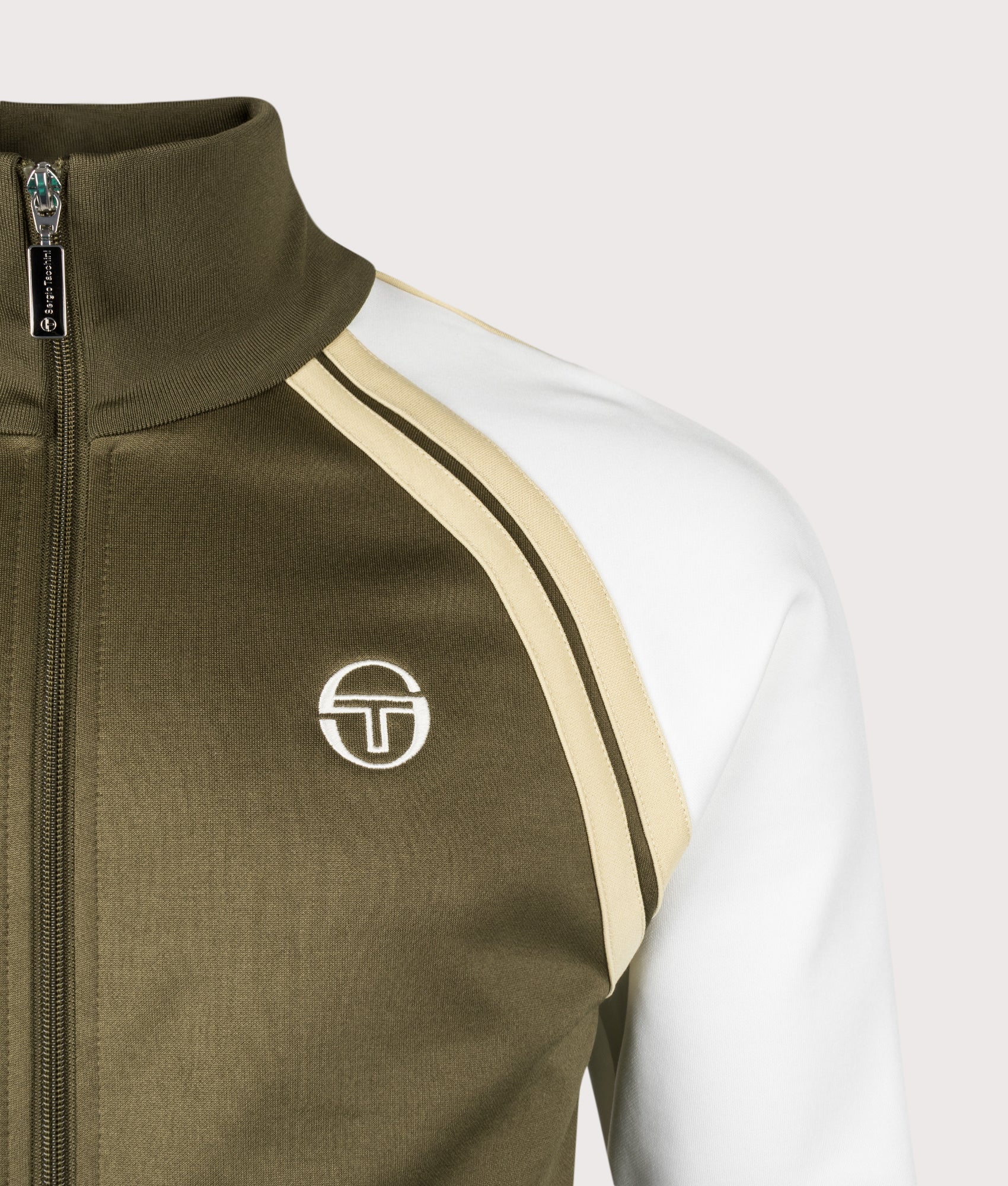 Sergio Tacchini Ghibli Davis Track Top in Dark Olive, Gardenia and Mojave Desert at EQVVS Menswear. Detail shot.
