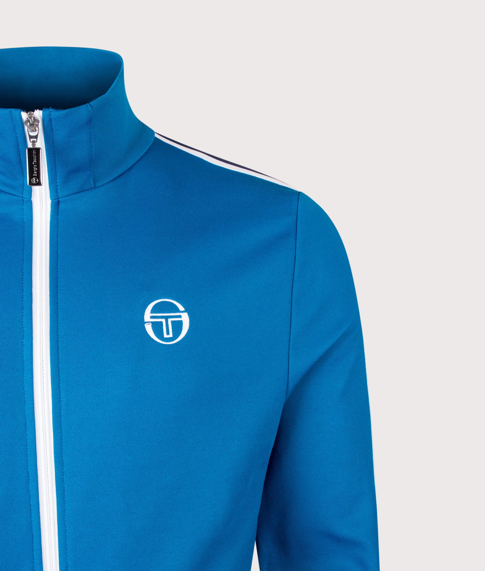 Sergio Tacchini New Cortana Track Top in Mykonos Blue and White at EQVVS Menswear. Detail shot.