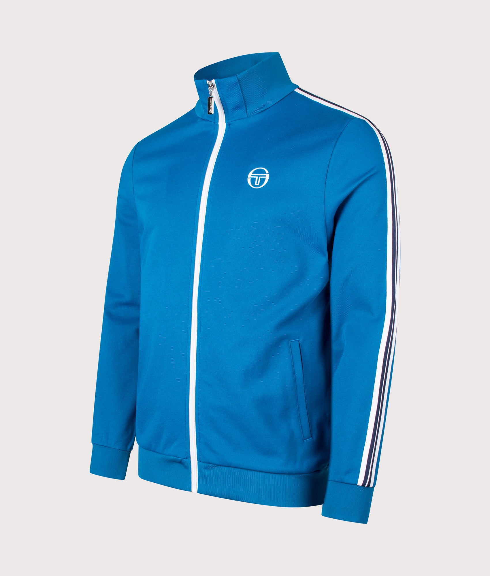Sergio Tacchini New Cortana Track Top in Mykonos Blue and White at EQVVS Menswear. Angled front shot.