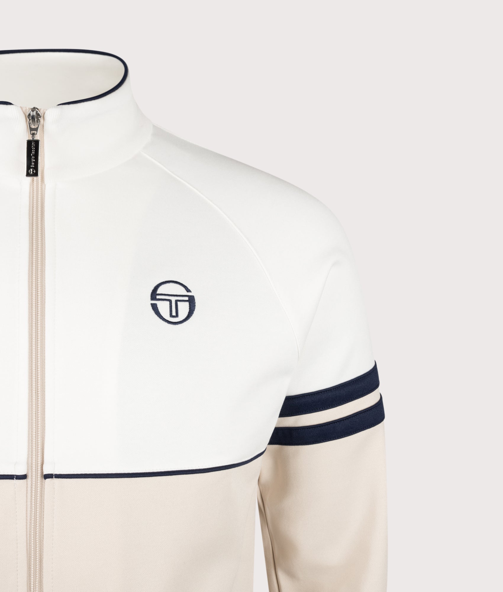 Sergio Tacchini Orion Track Top in Gardenia, Sandshell and Maritime Blue at EQVVS Menswear. Detail shot. 
