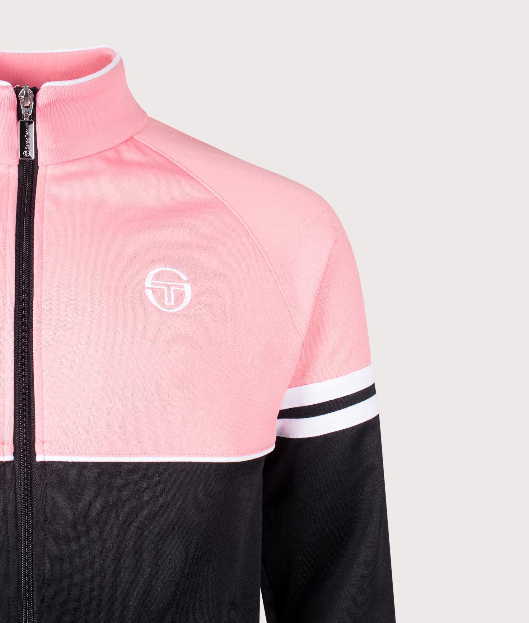 Sergio Tacchini Orion Track Top in Geranium Pink, Black and White at EQVVS Menswear. Detail shot.