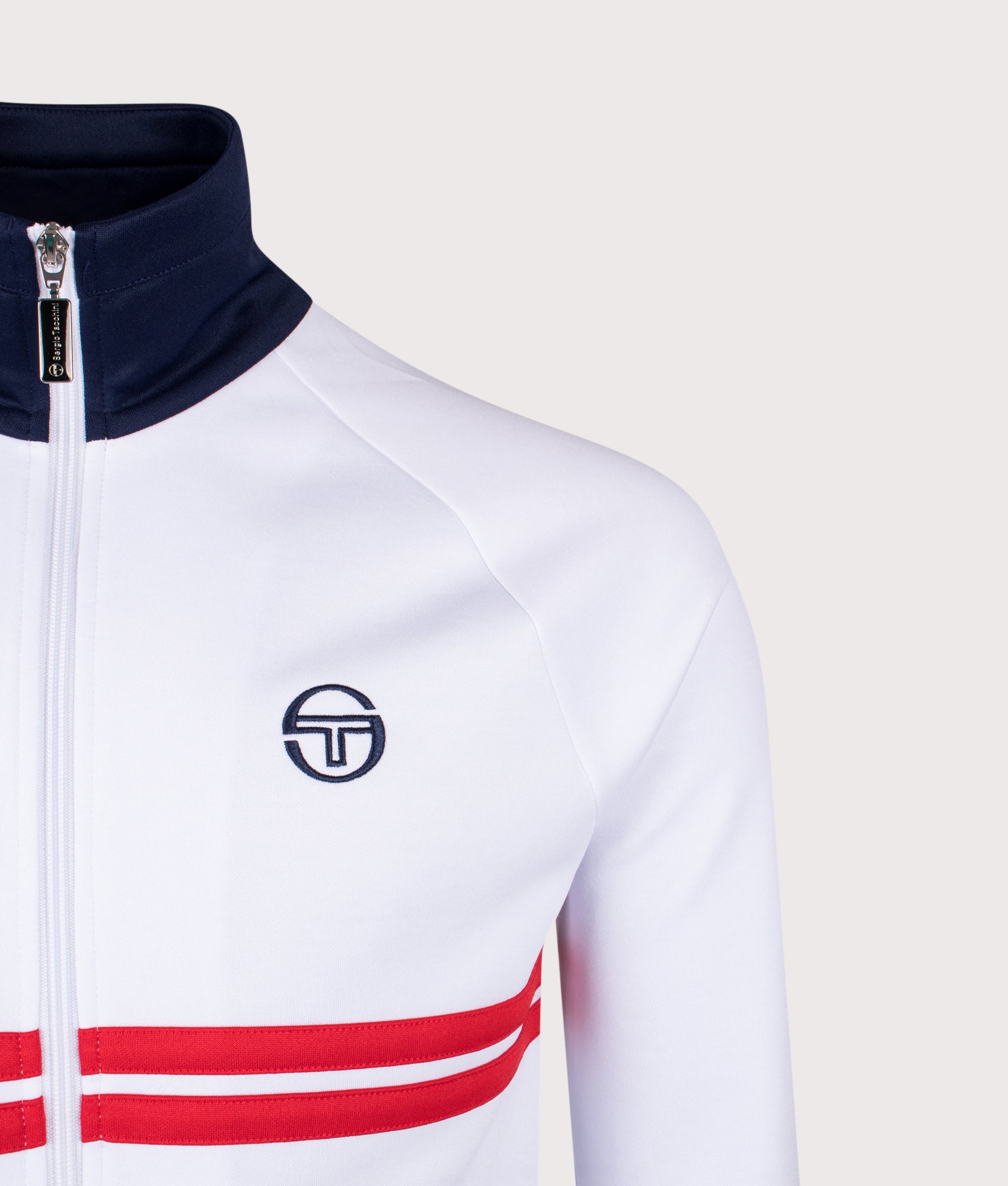 Sergio Tacchini Dallas Track Top in White, Maritime Blue and Adrenaline Rush at EQVVS Menswear. Detail shot.