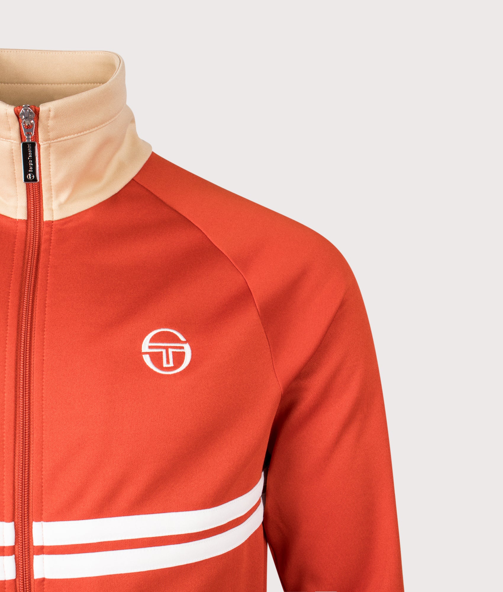Sergio Tacchini Dallas Track Top in Rooibos Tea, Mojave Desert and Gardenia at EQVVS Menswear. Detail shot.