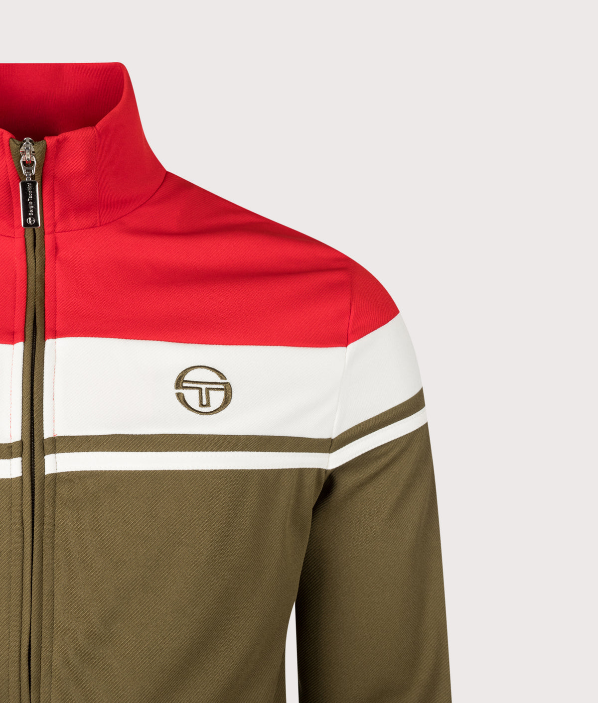 Sergio Tacchini Damarindo Track Top in Adrenaline Rush, Gardenia and Dark Olive at EQVVS Menswear. Detail shot.