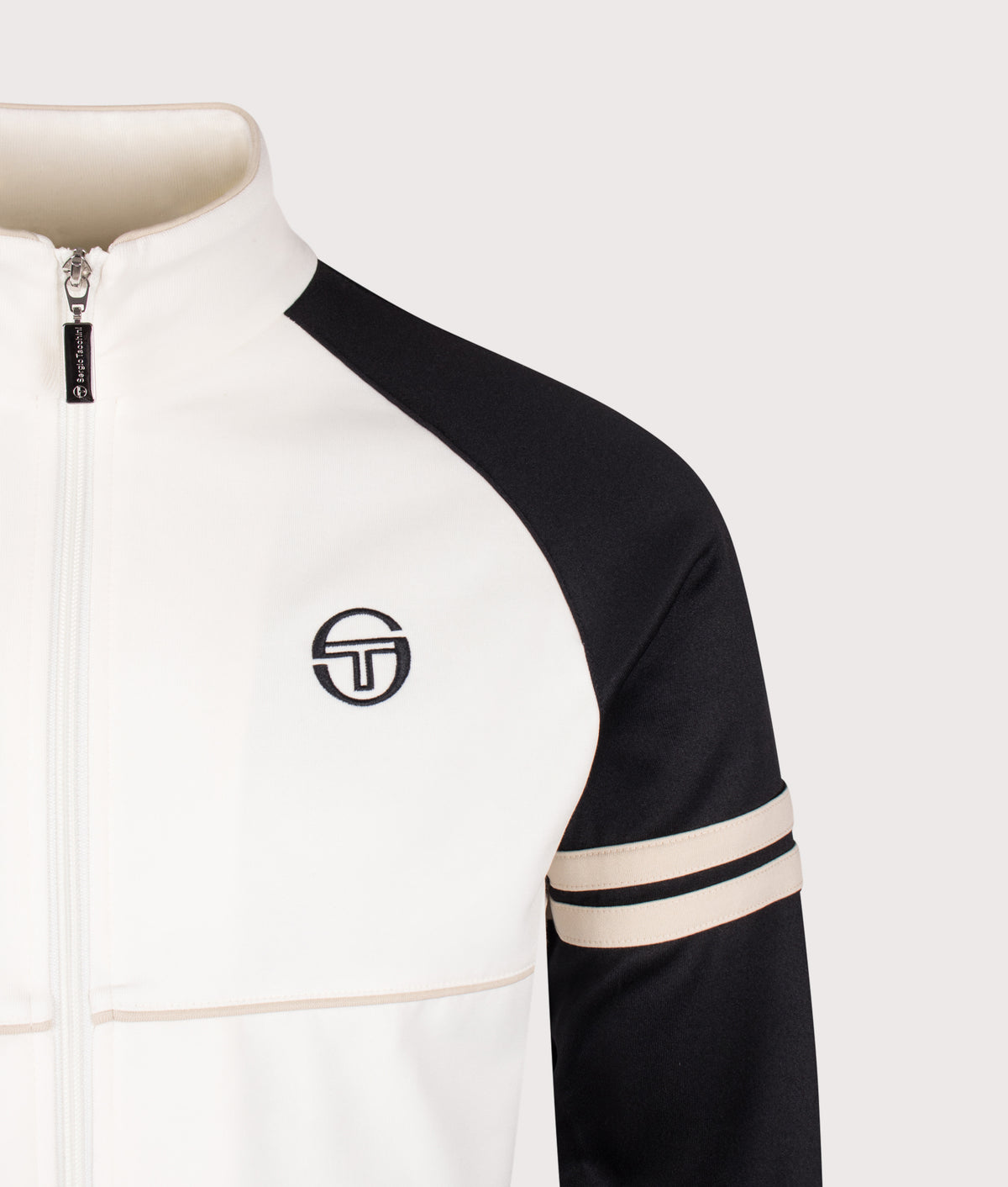Sergio Tacchini Slim Fit Orion Track Top in Gardenia, Black and Peyote at EQVVS Menswear. Detail shot.