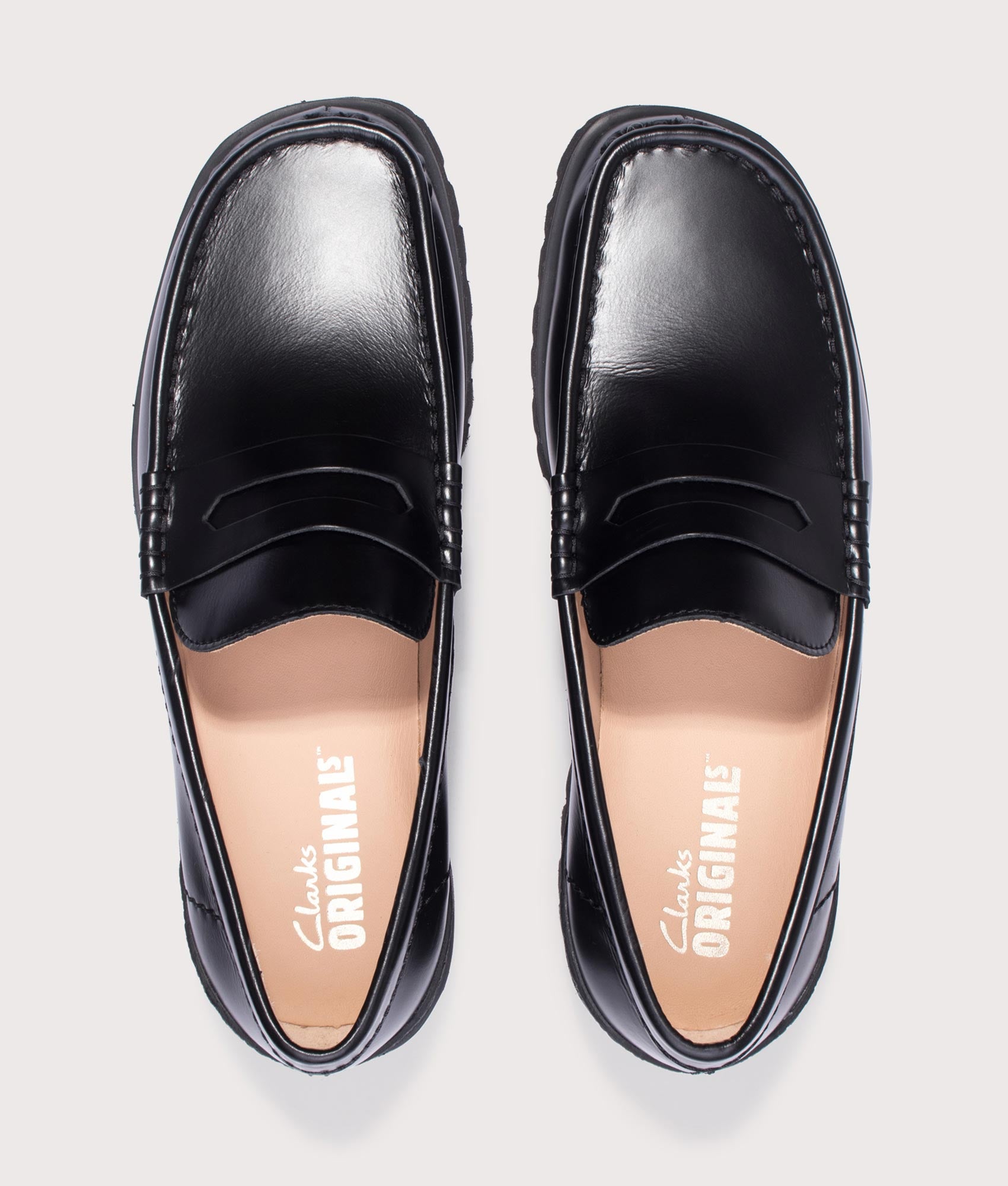 Clarks Originals Yukoner Penny Loafers in Black Leather at EQVVS Menswear. Top shot.
