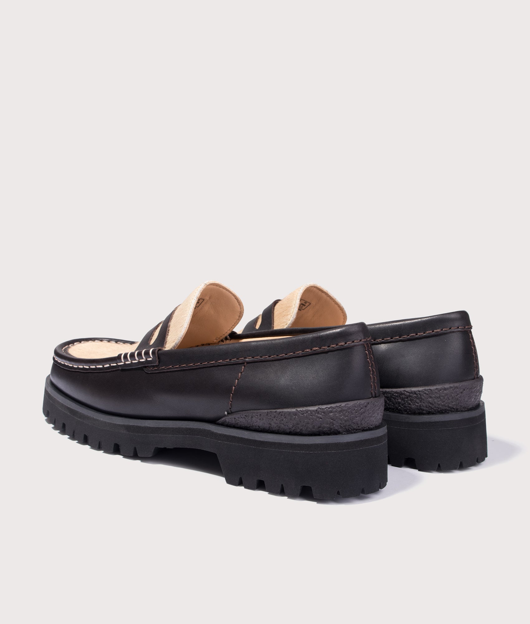 Clarks Original Yukoner Penny Loafers  in Brown Combi Leather at EQVVS Menswear. Angled back shot.
