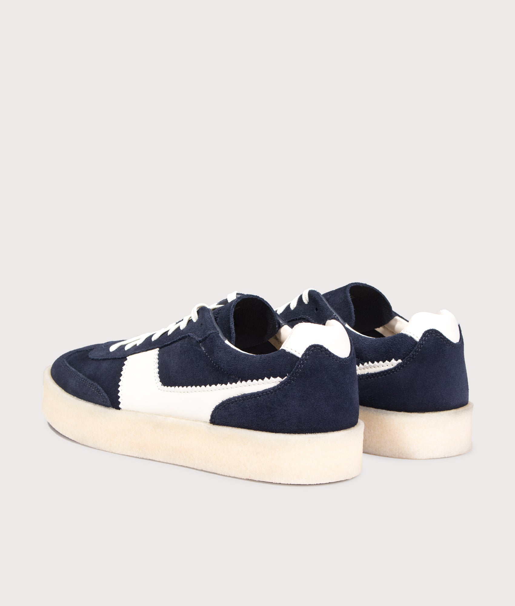 Clarks Original Tor 80 Sneakers in Navy Combi at EQVVS Menswear. Angled back shot.